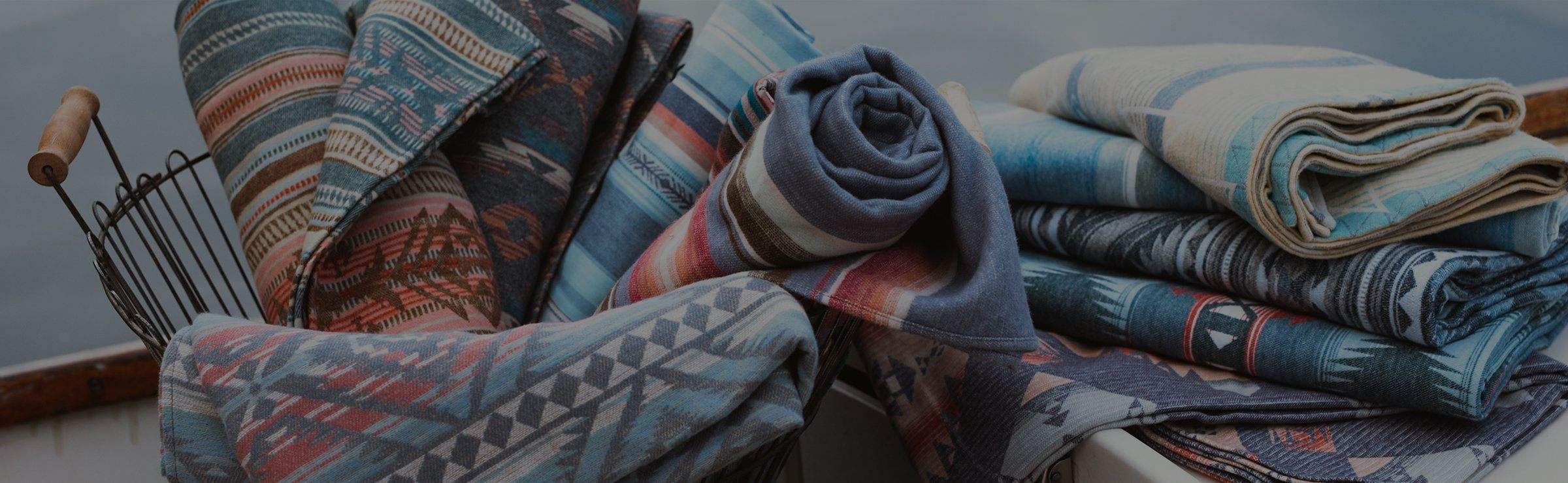 a still image of Faherty brand blankets and throws