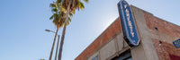 Faherty Store Sign with Palm Trees