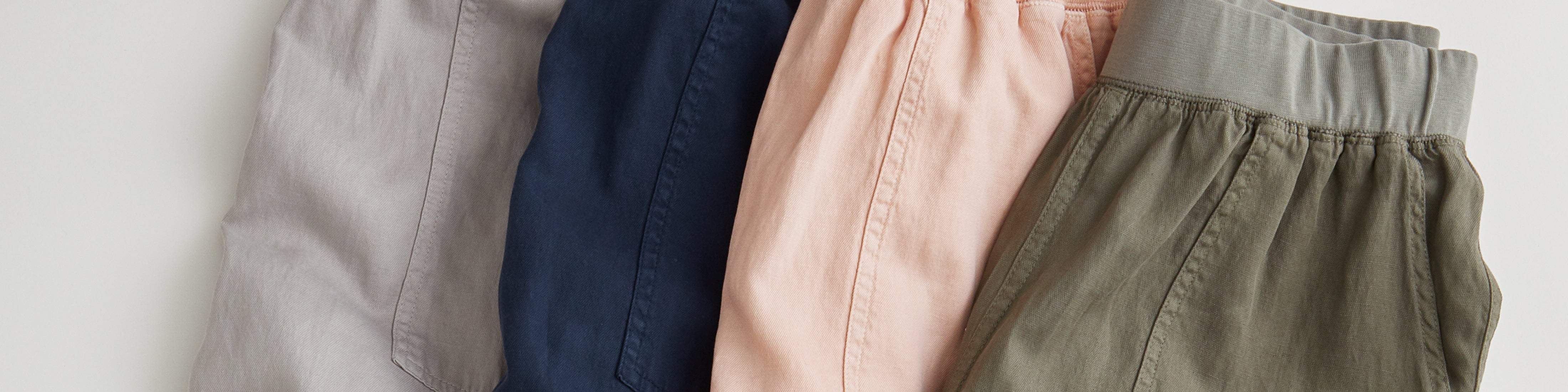 A flat of Arlie Day Pants in four different colors.