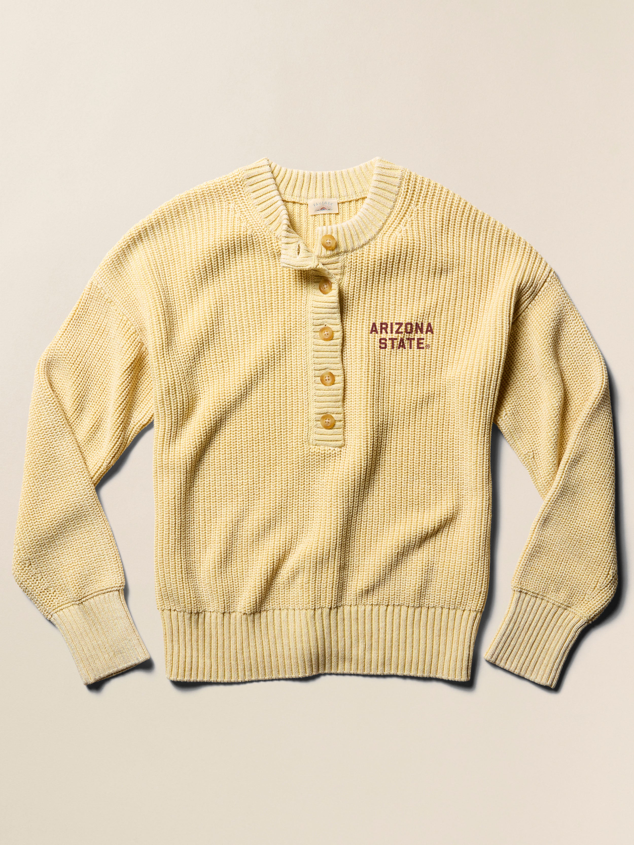 Yellow ribbed sweater with Arizona State University graphic against a beige background