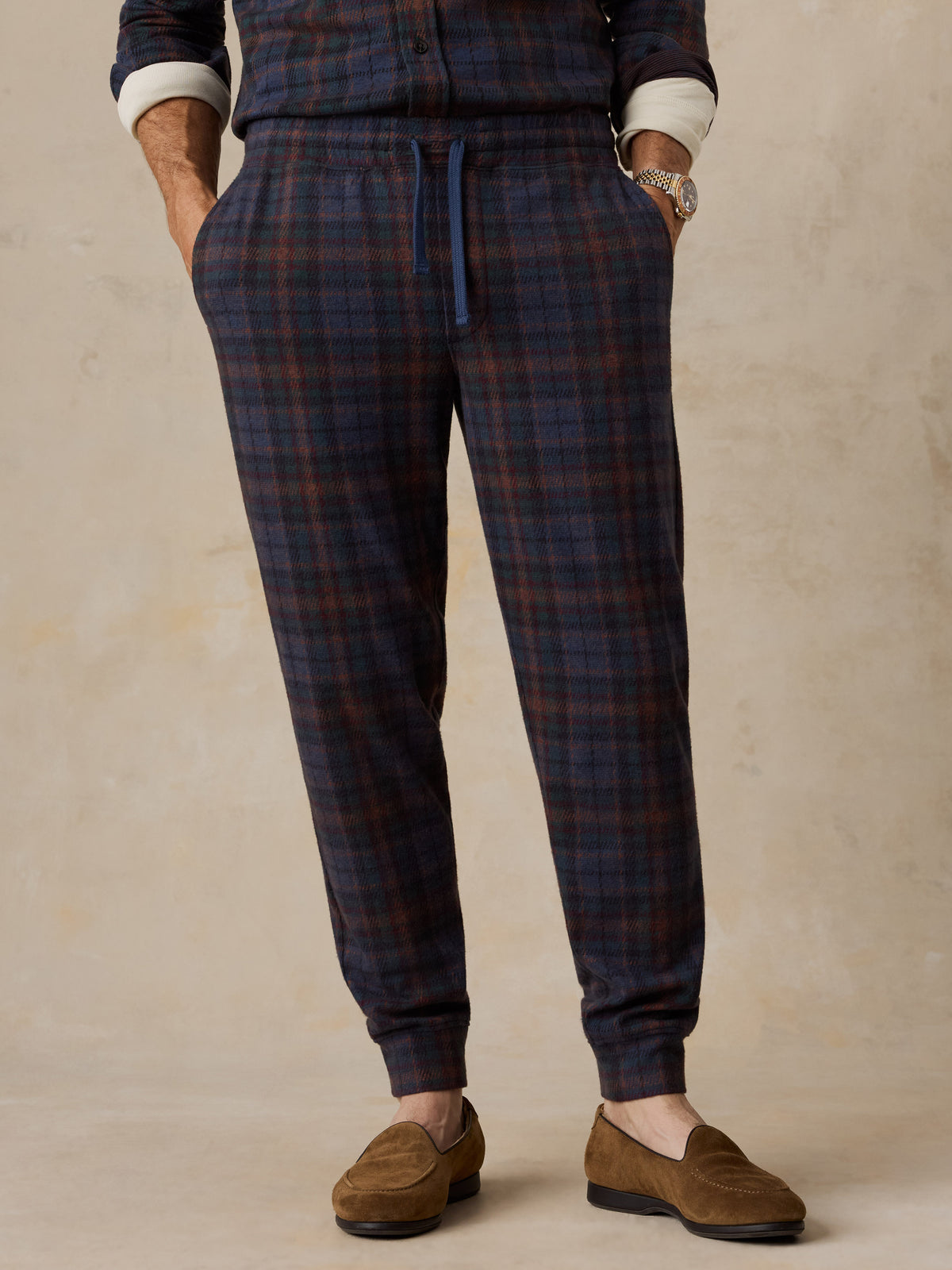 A man wearing a plaid lounge set, image 2 of 6