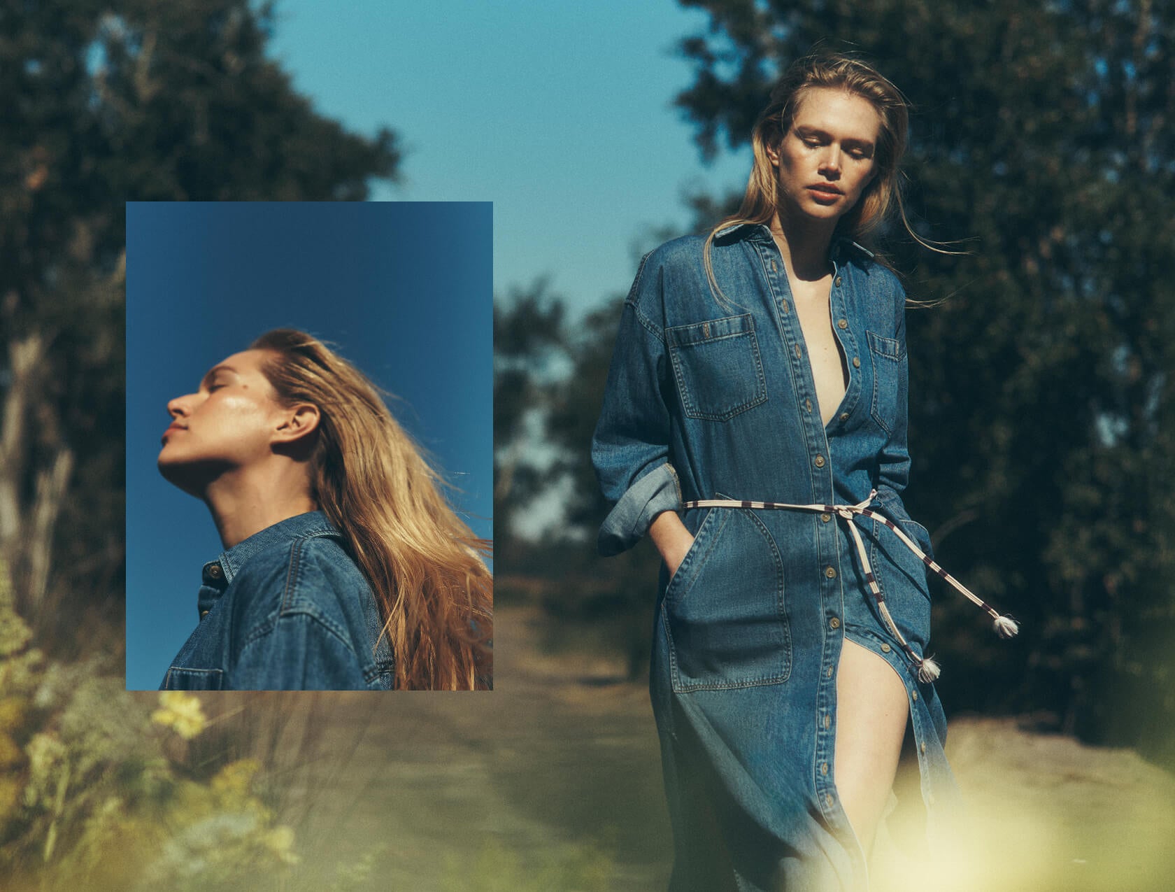 Female model wearing a long, blue denim shirtdress walking down a garden path