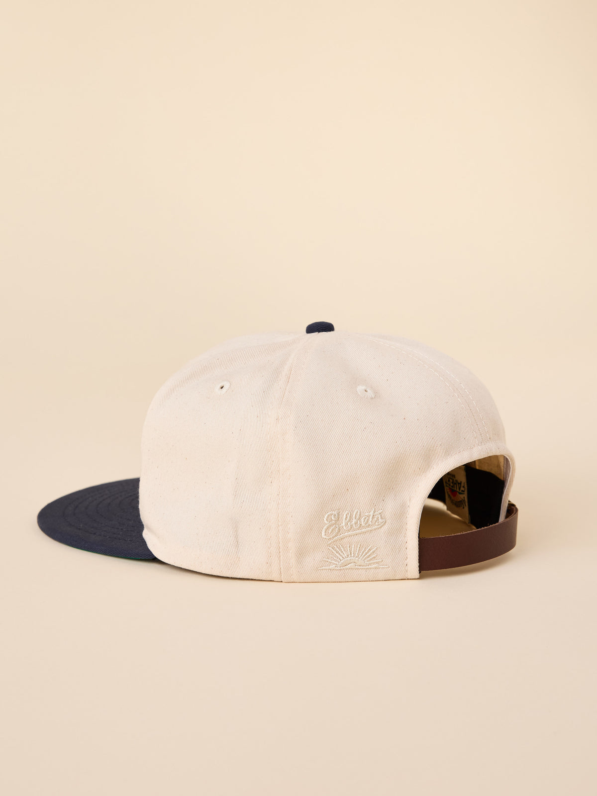 A natural and navy Notre Dame ballcap viewed from behind, image 2 of 3