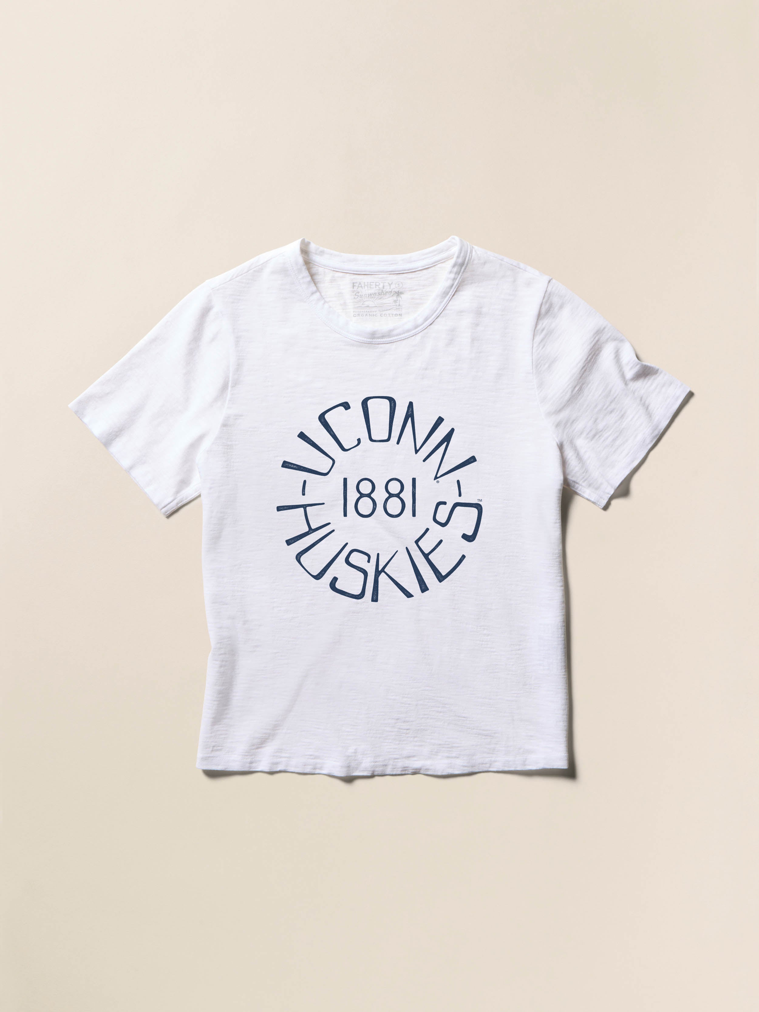 White t-shirt with UConn Huskies 1881 graphic on the center front against a beige background