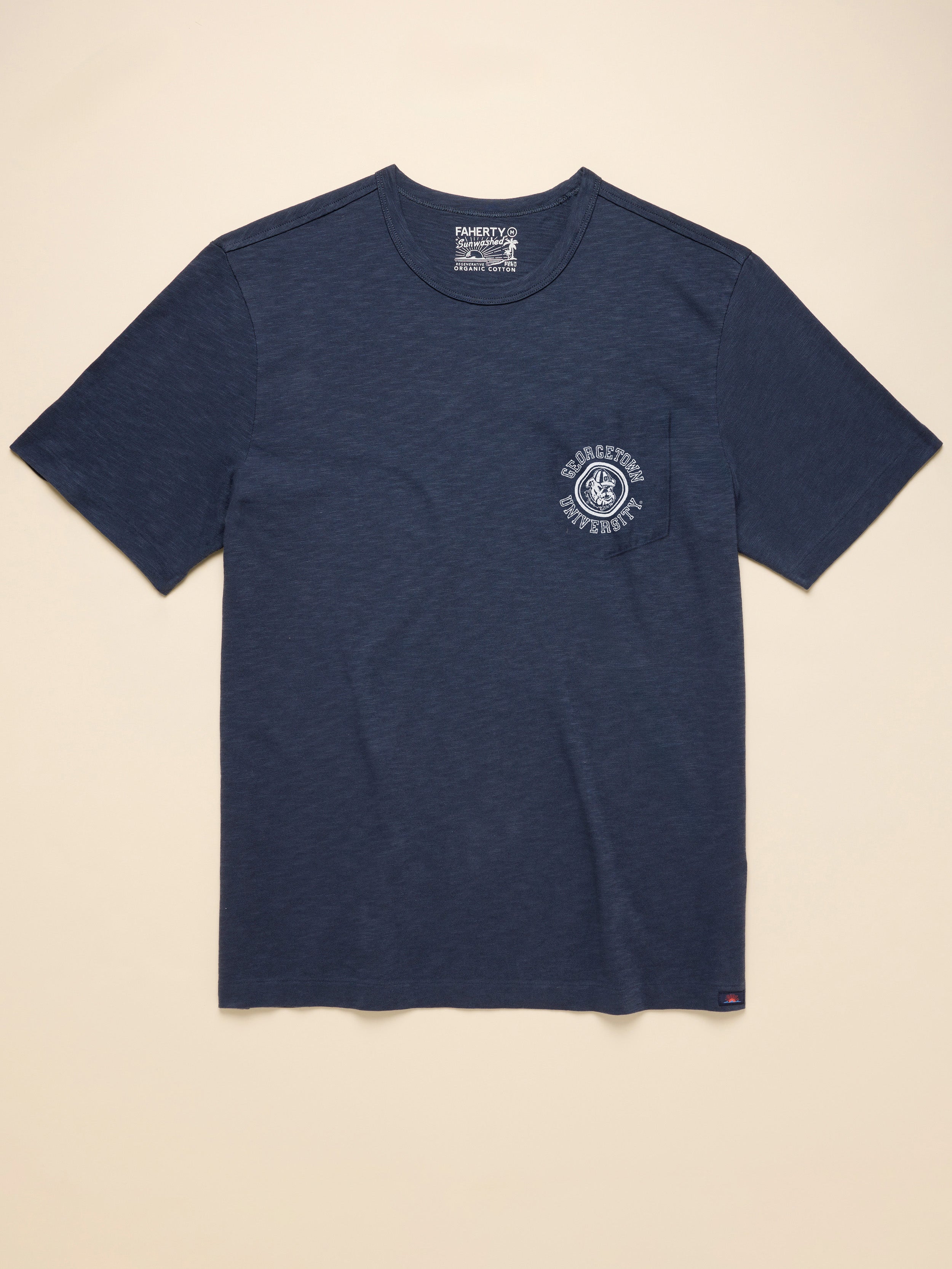 Navy blue short sleeve t-shirt with Georgetown graphic on the left chest pocket against a beige background