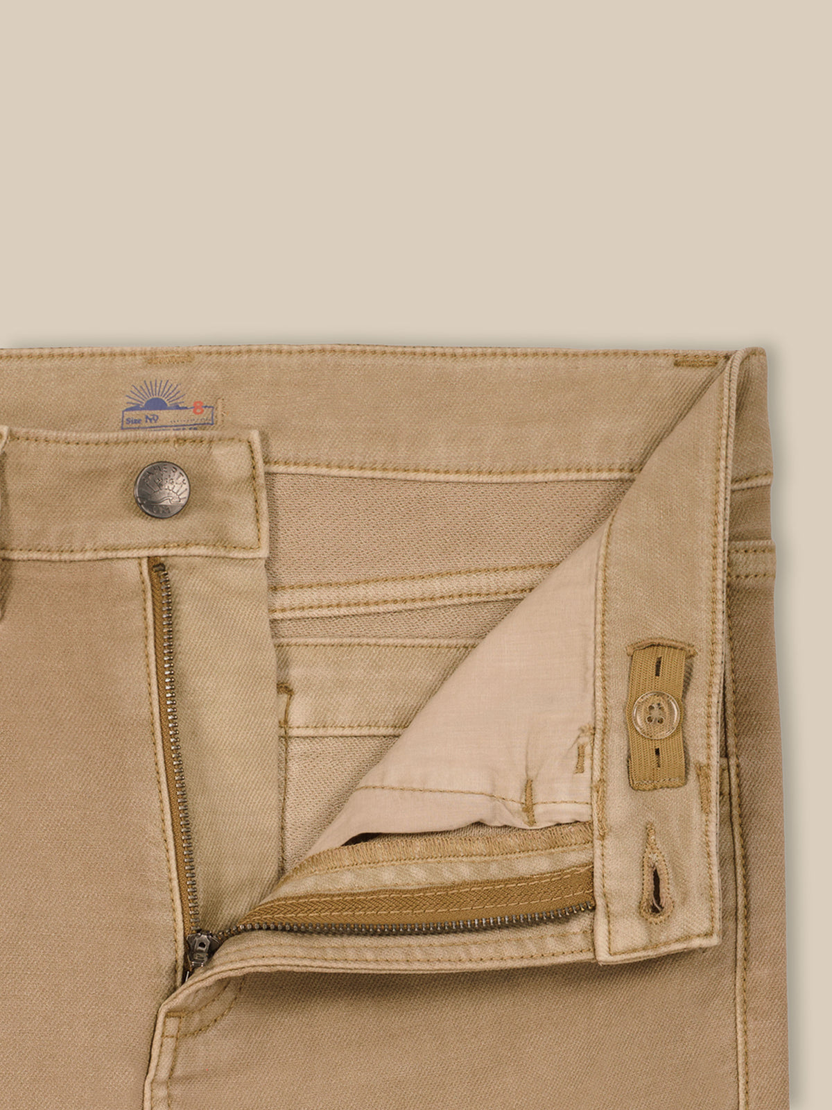 Close up of beige pants with an adjustable waistband, image 6 of 6