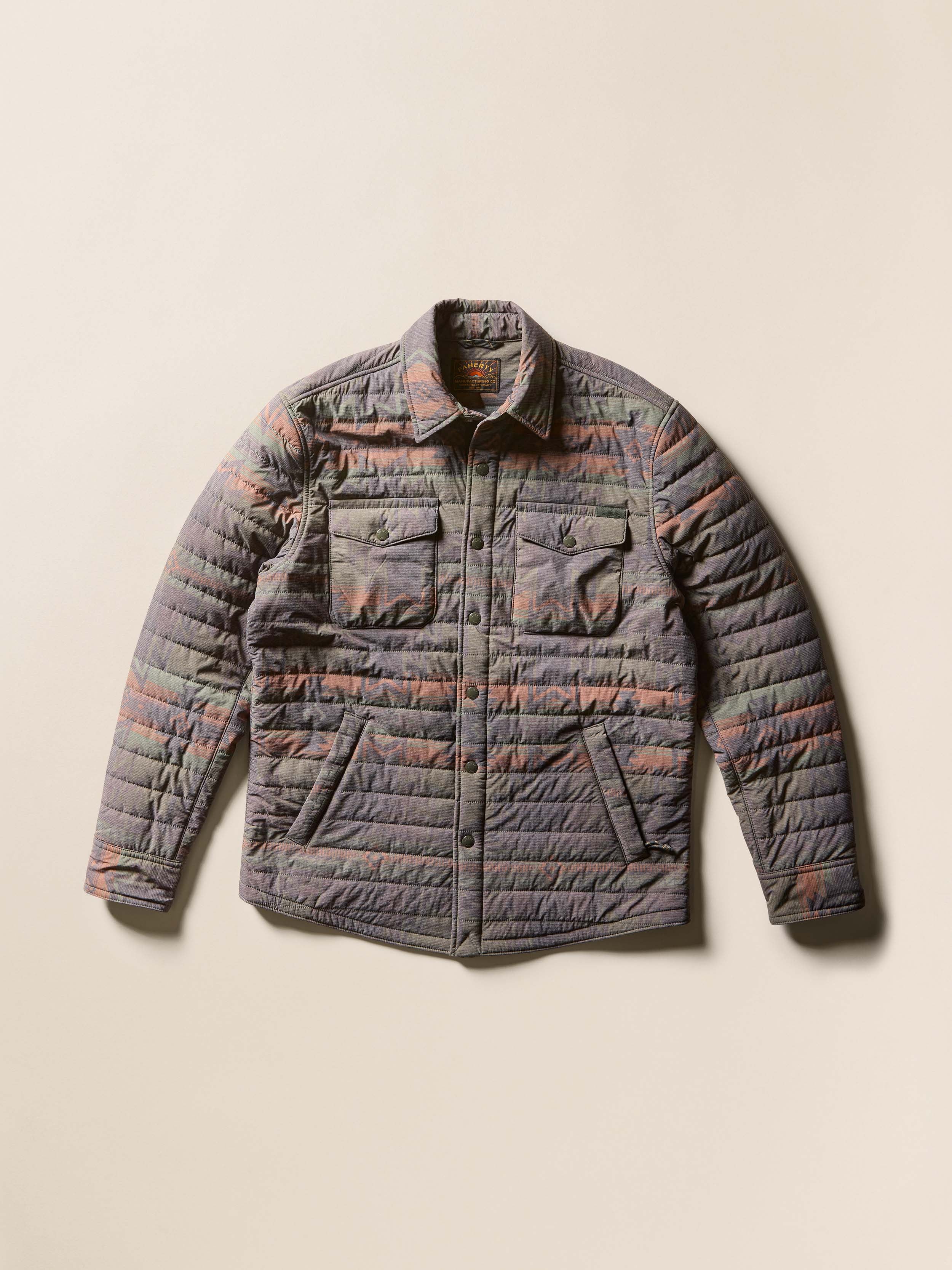 A patterned quilted overshirt against a beige background