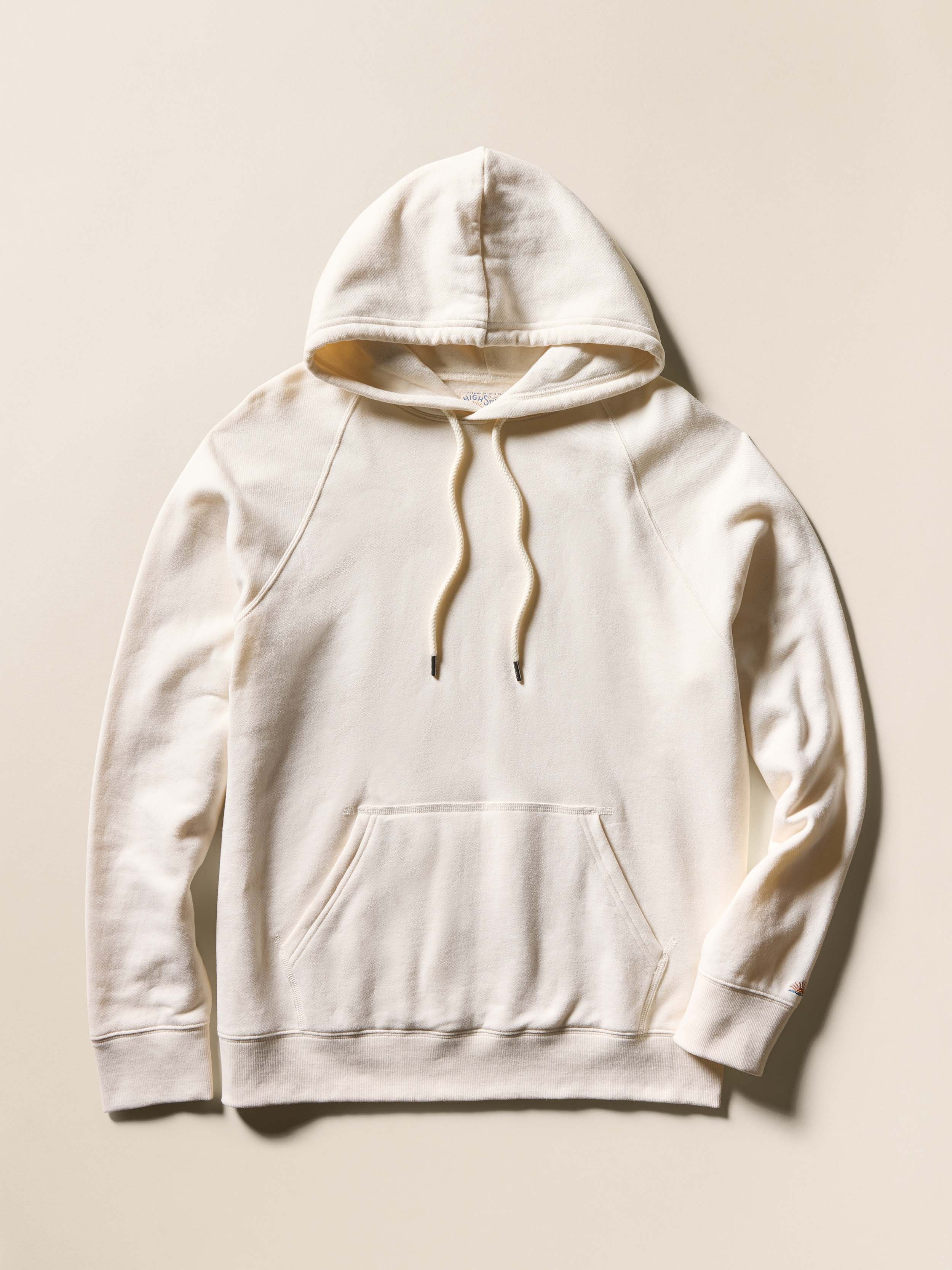 Cream hoodie on a beige background