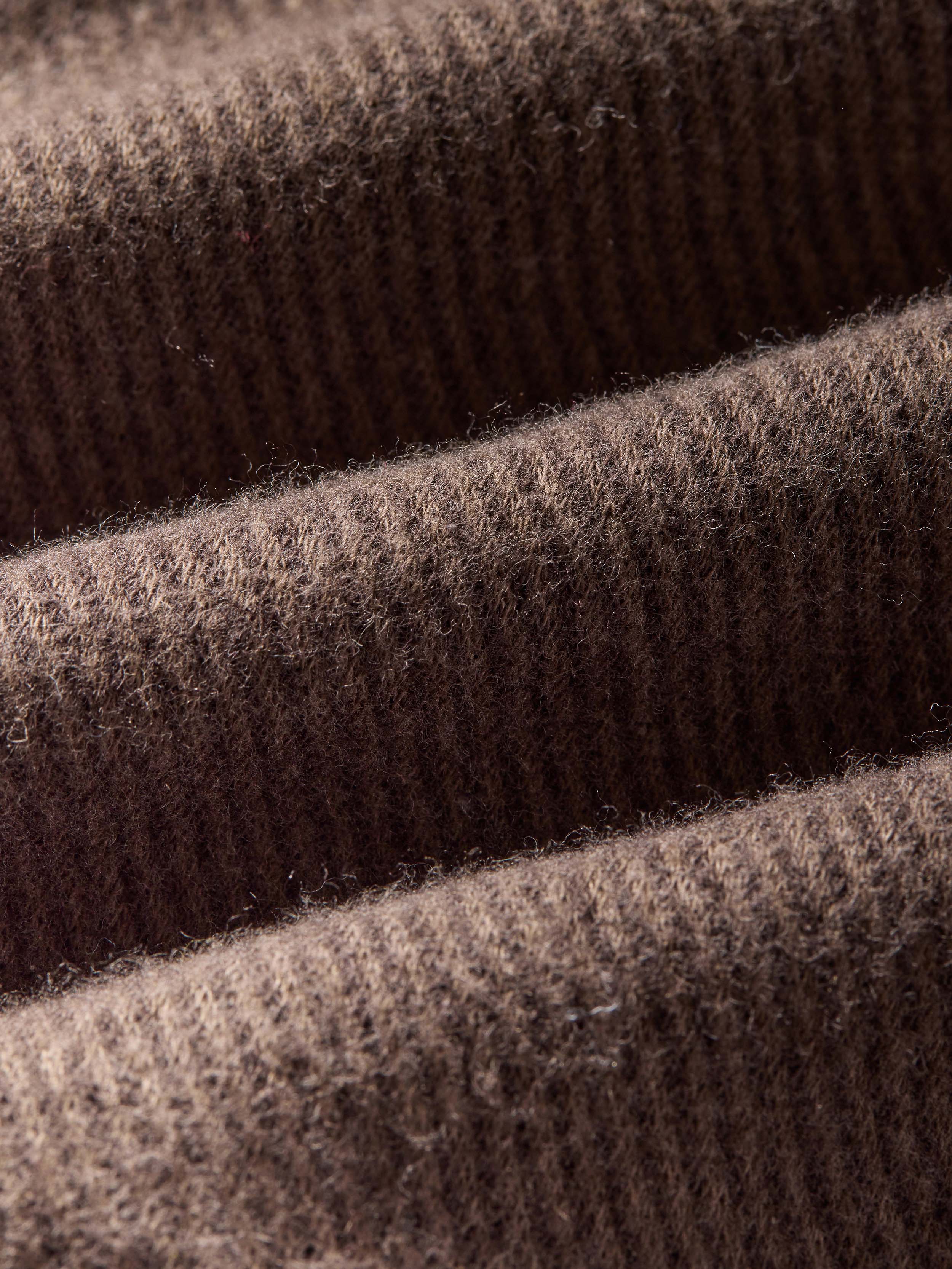 Close-up of brown fabric with a textured surface