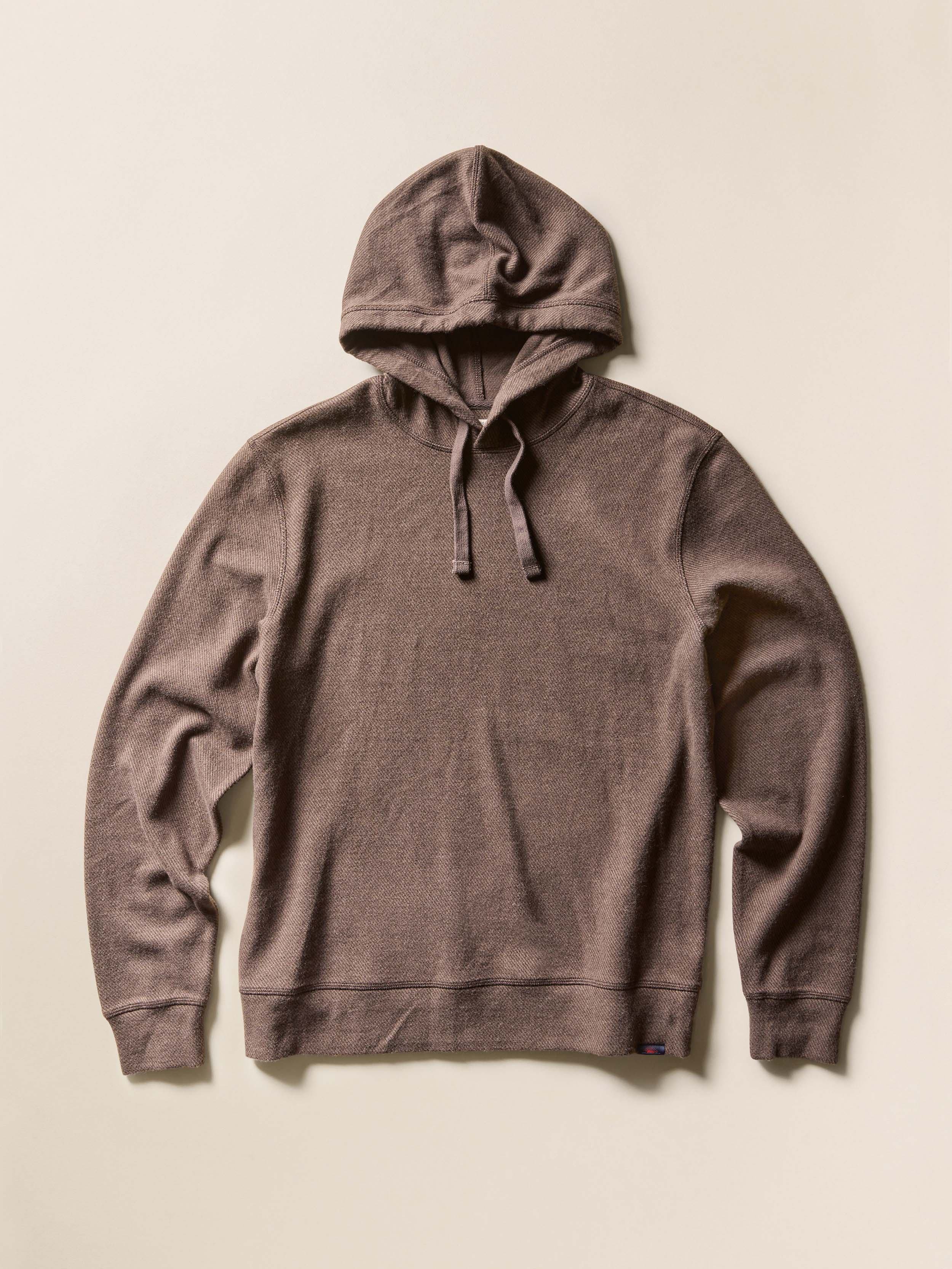 Brown hoodie on a beige background