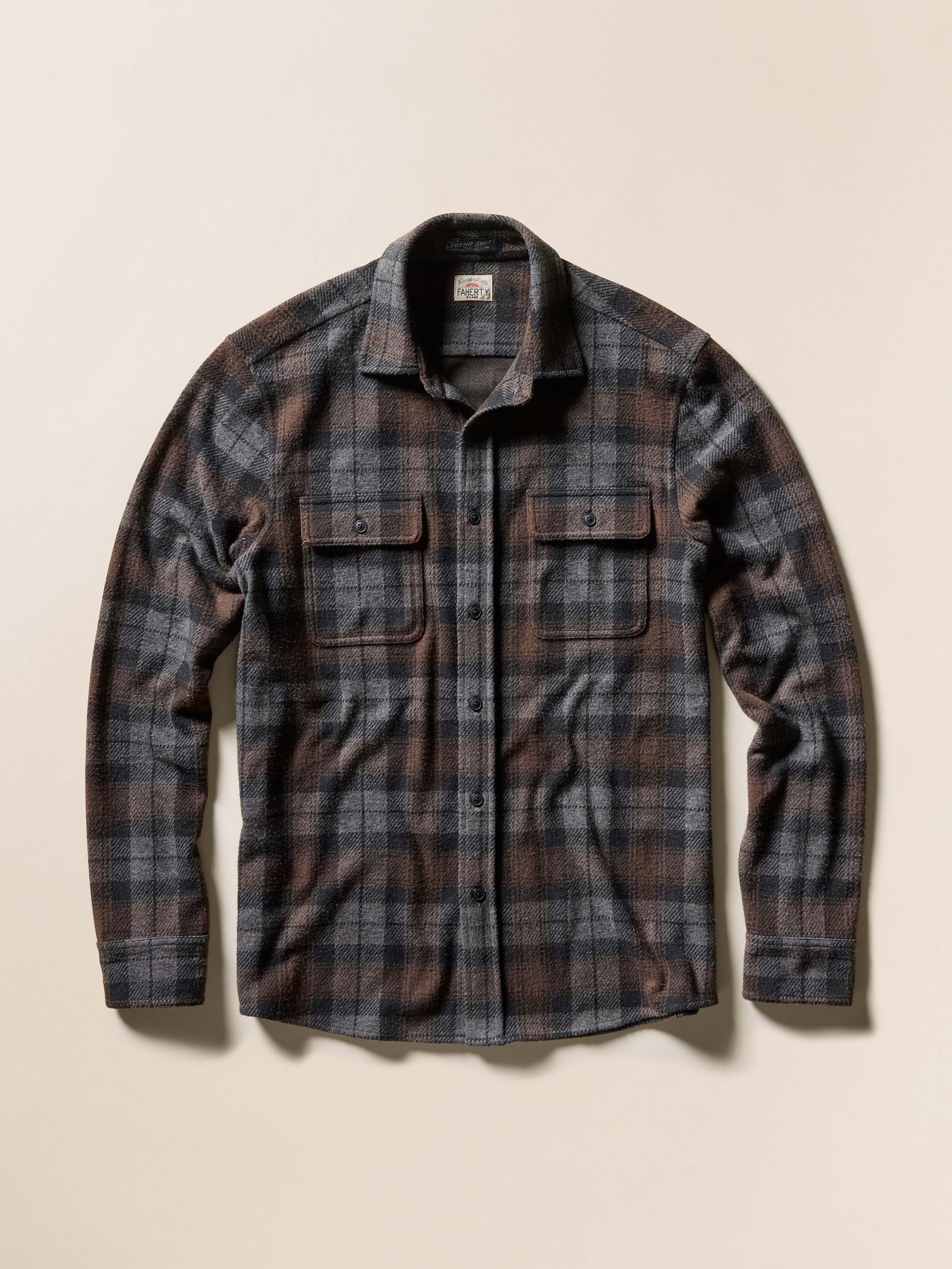 A brown and grey plaid shirt, against a beige background