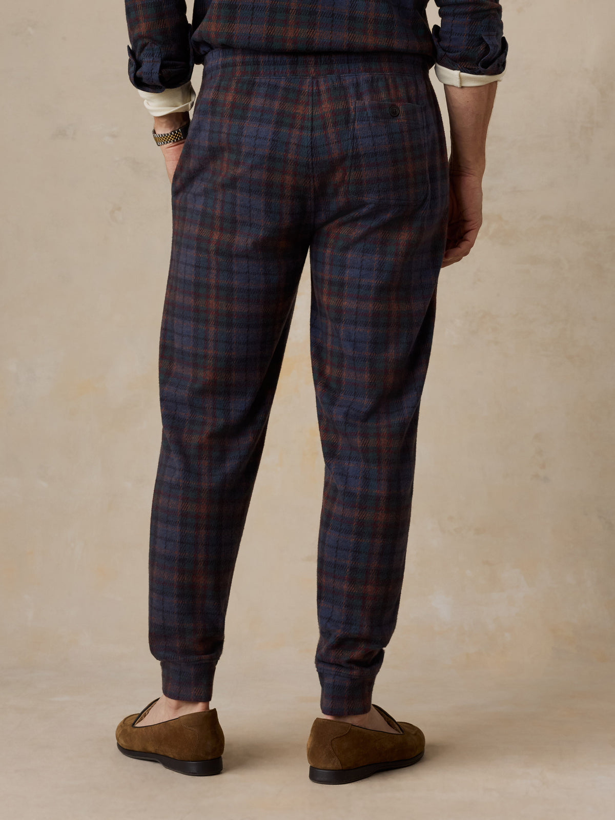 A man viewed from behind wearing a plaid lounge set, image 4 of 6