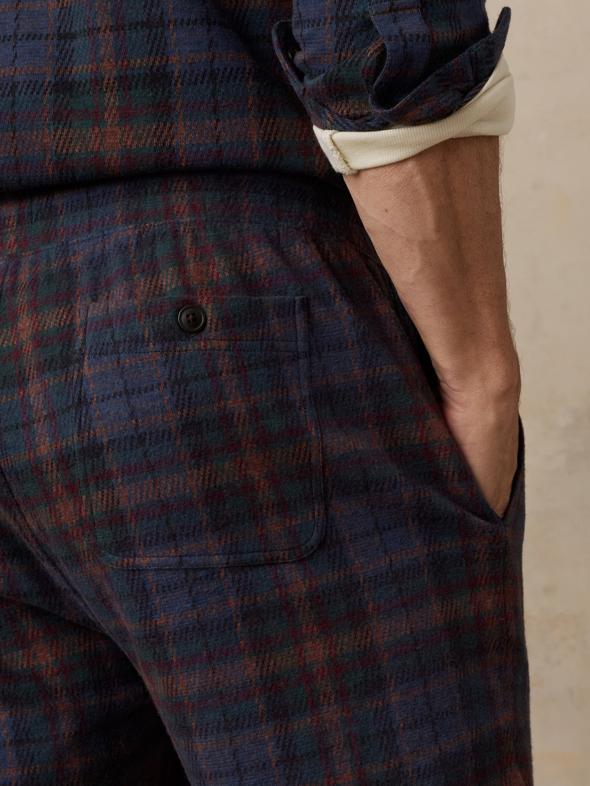 Close up of a man viewed from behind wearing a plaid lounge set, image 6 of 6