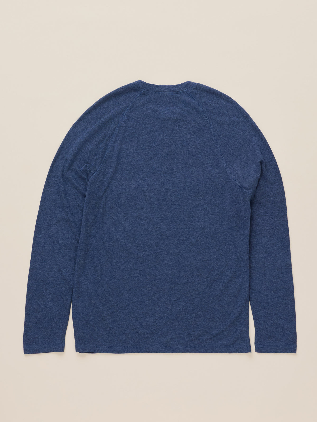A heathered blue long-sleeve shirt shown from the back, laid flat against a light beige background.