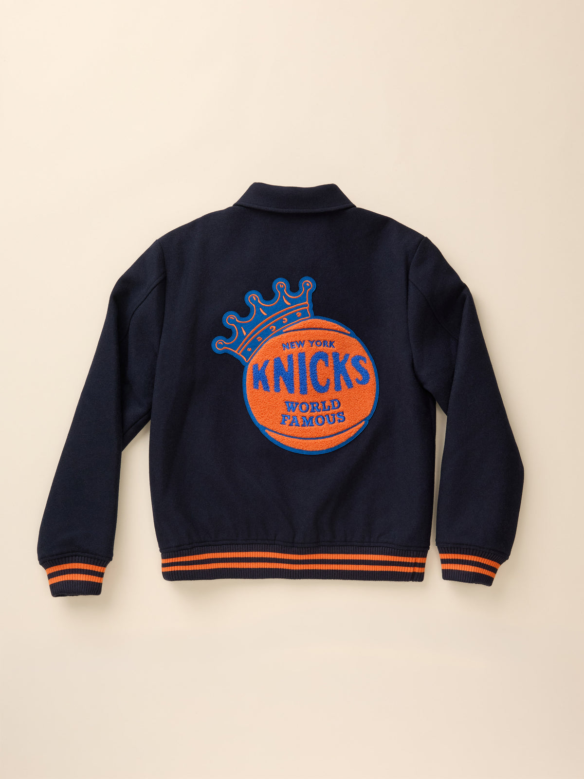 A navy NY Knicks varsity jacket viewed from the back , image 8 of 8