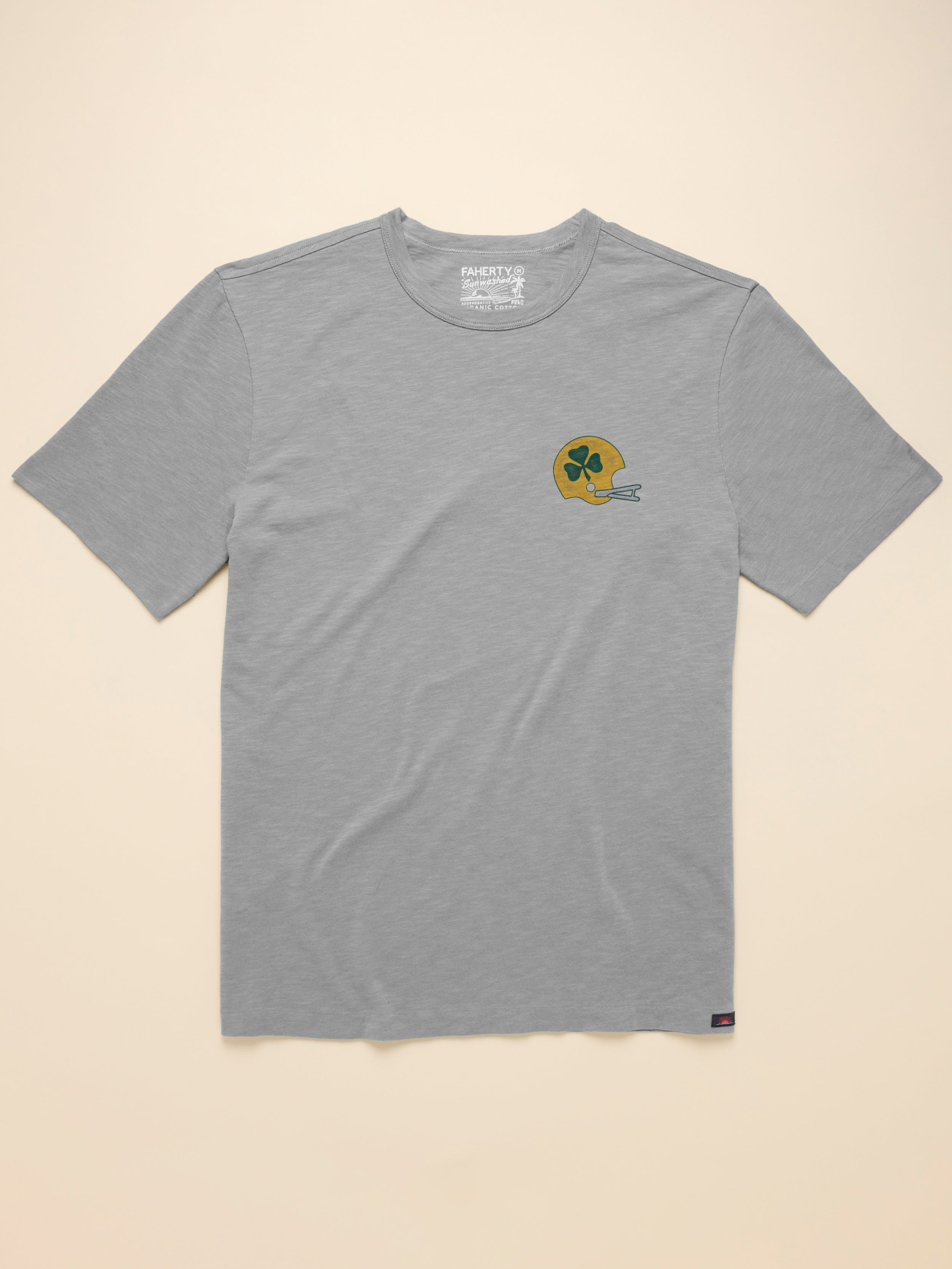 Gray t-shirt with a Notre Dame graphic on a beige background