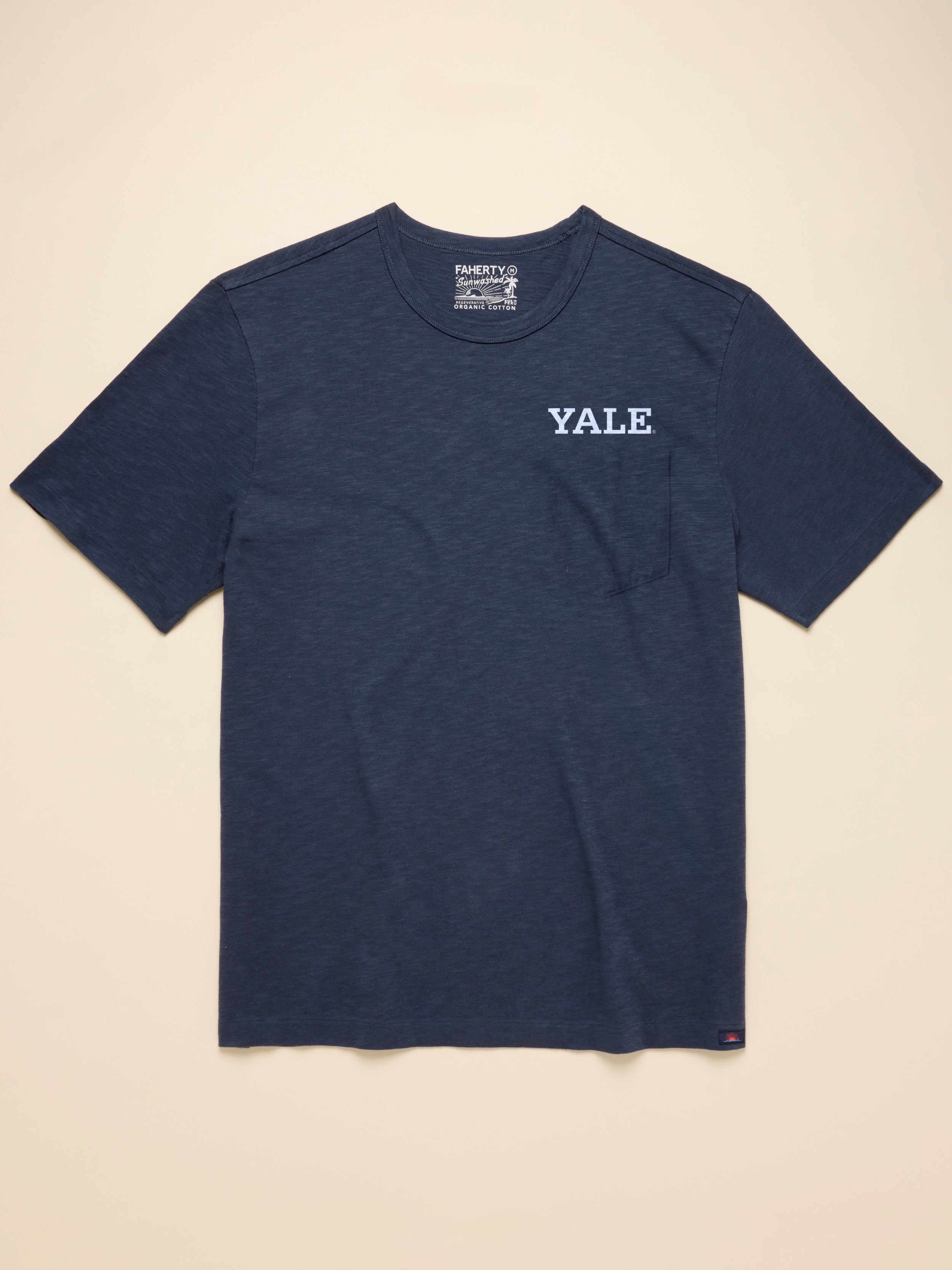 Navy blue t-shirt with Yale graphic logo on a beige background
