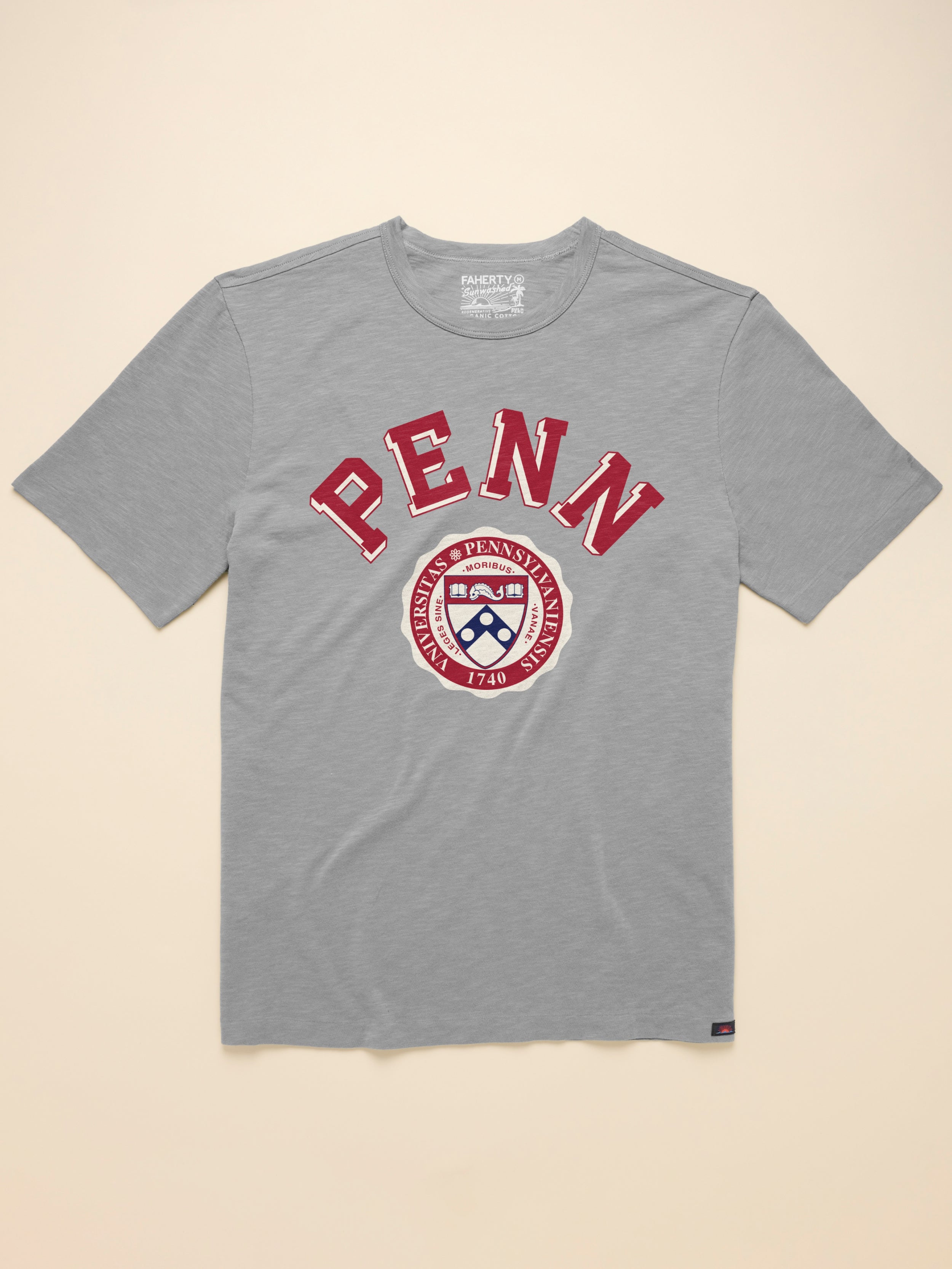 Grey t-shirt with University of Pennsylvania graphic at the front against a beige background