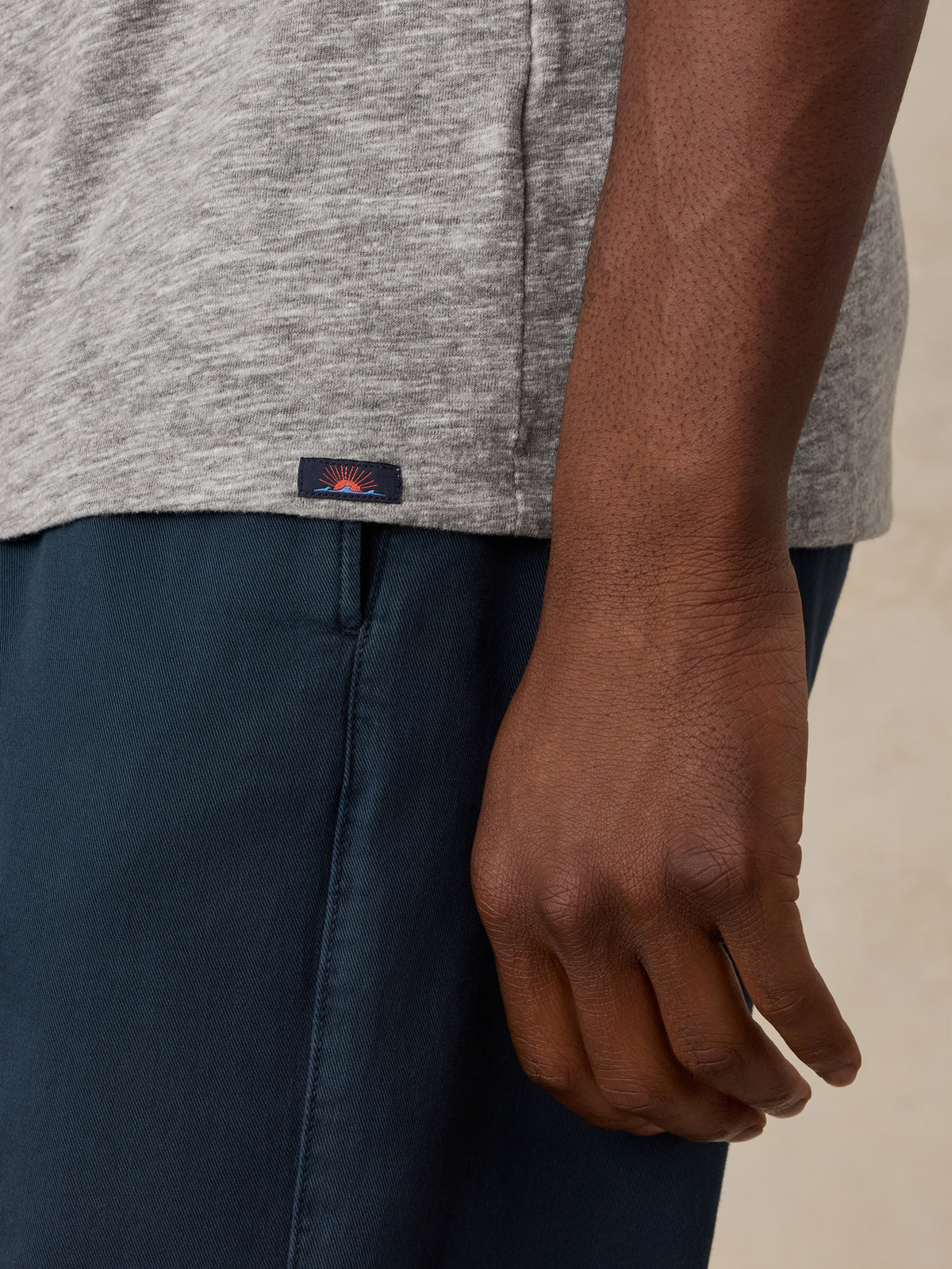 Close up of a man wearing a grey NY Knicks tee, image 4 of 6