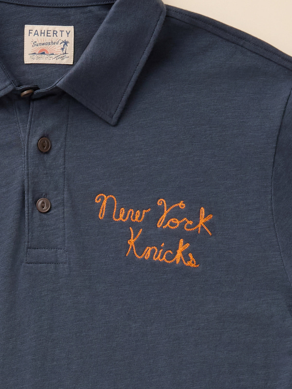 Close up of a navy NY Knicks polo shirt, image 8 of 8