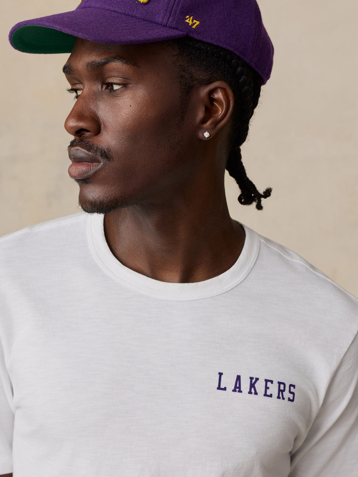 Close up of a man wearing a white LA Lakers tee, image 5 of 6
