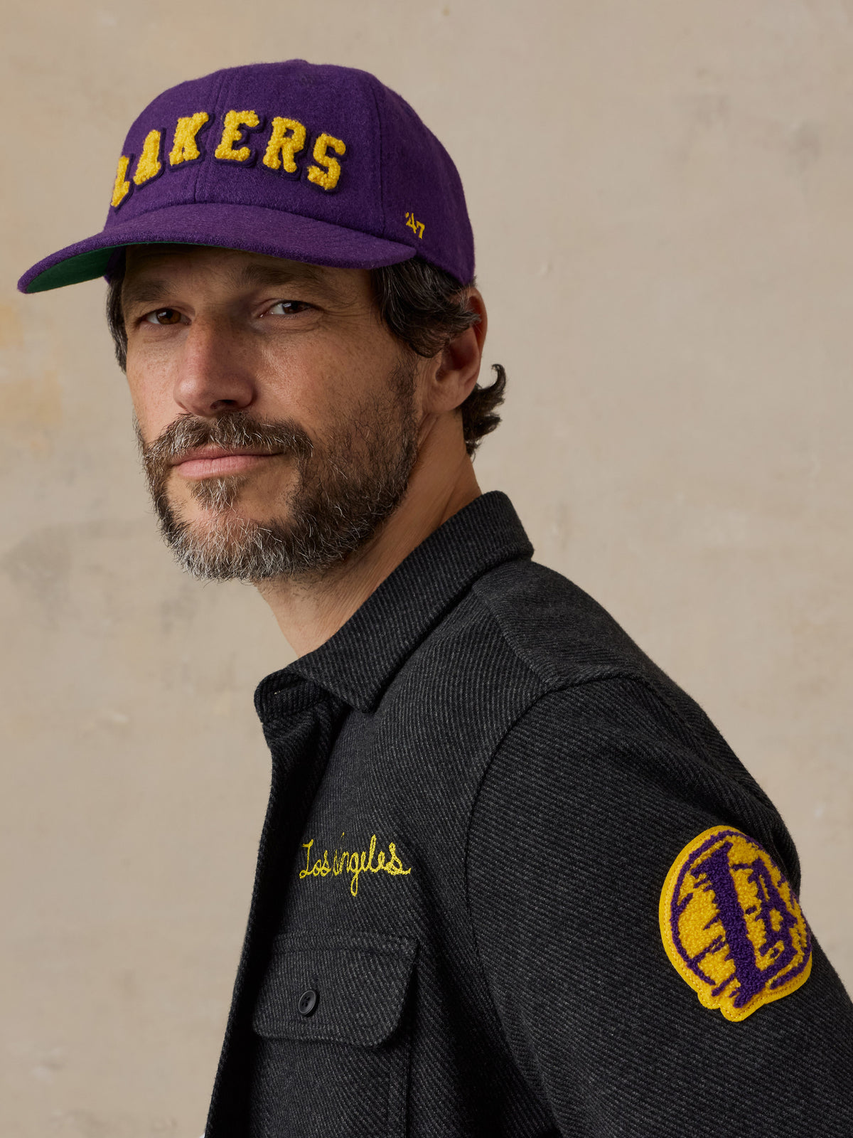 Close up of a man wearing a black LA Lakers shirt, image 2 of 6