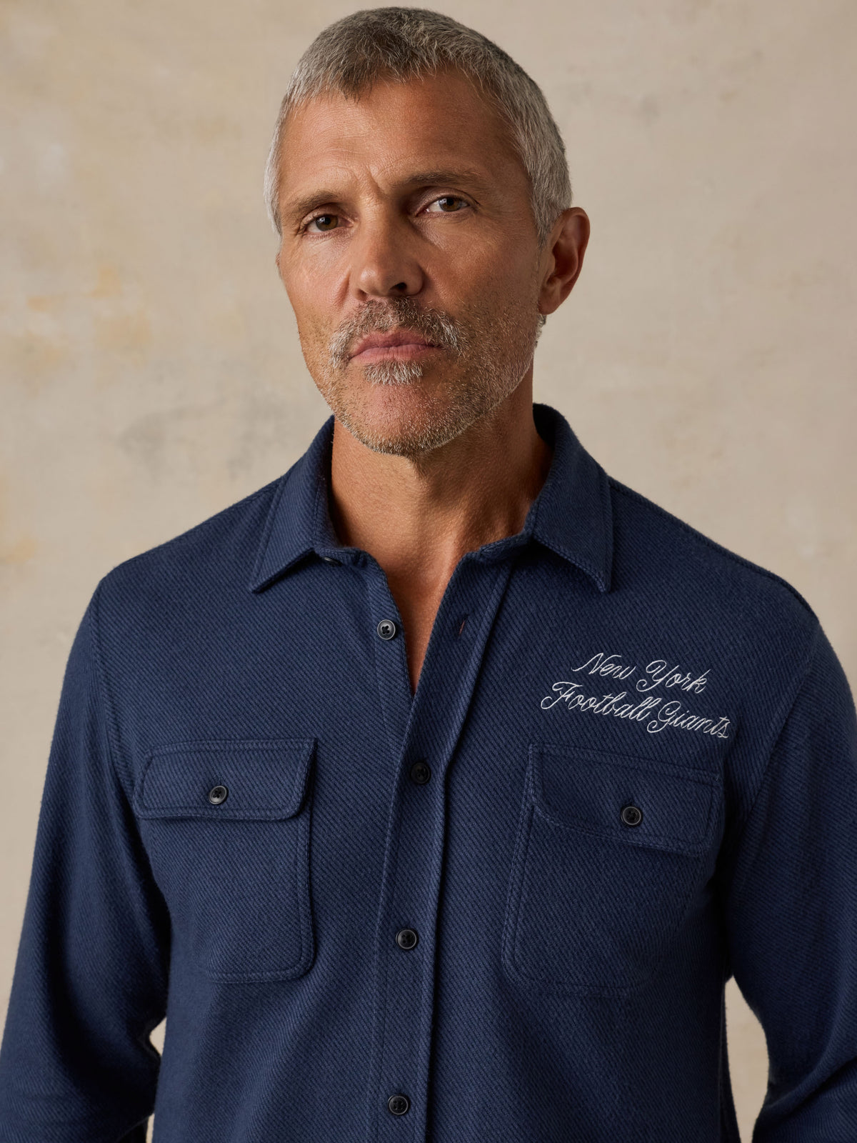 Man wearing a NY Giants button up shirt , image 6 of 7