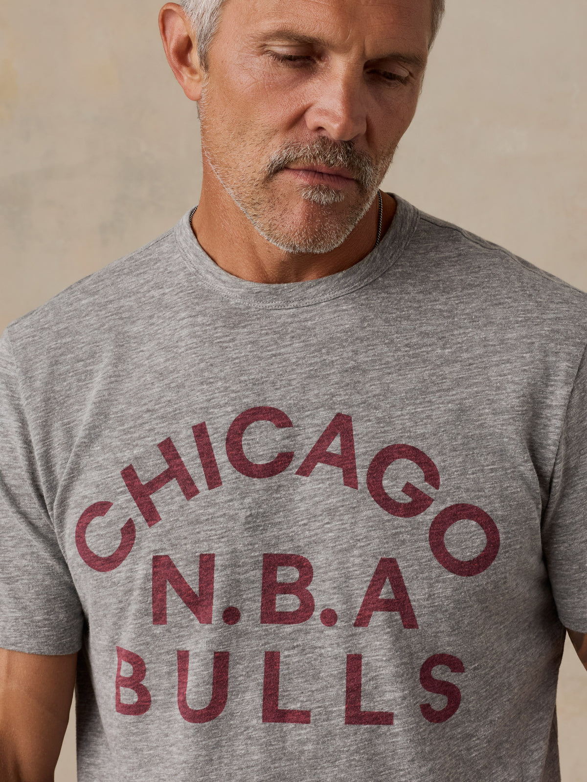 Close up of a man wearing a grey Chicago Bulls tee, image 6 of 6