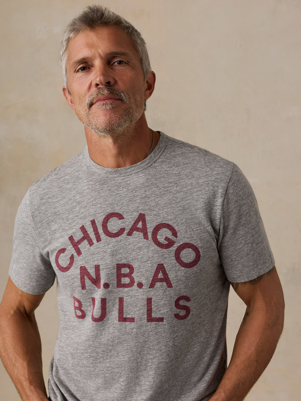 Close up of a man wearing a grey Chicago Bulls tee, image 3 of 6