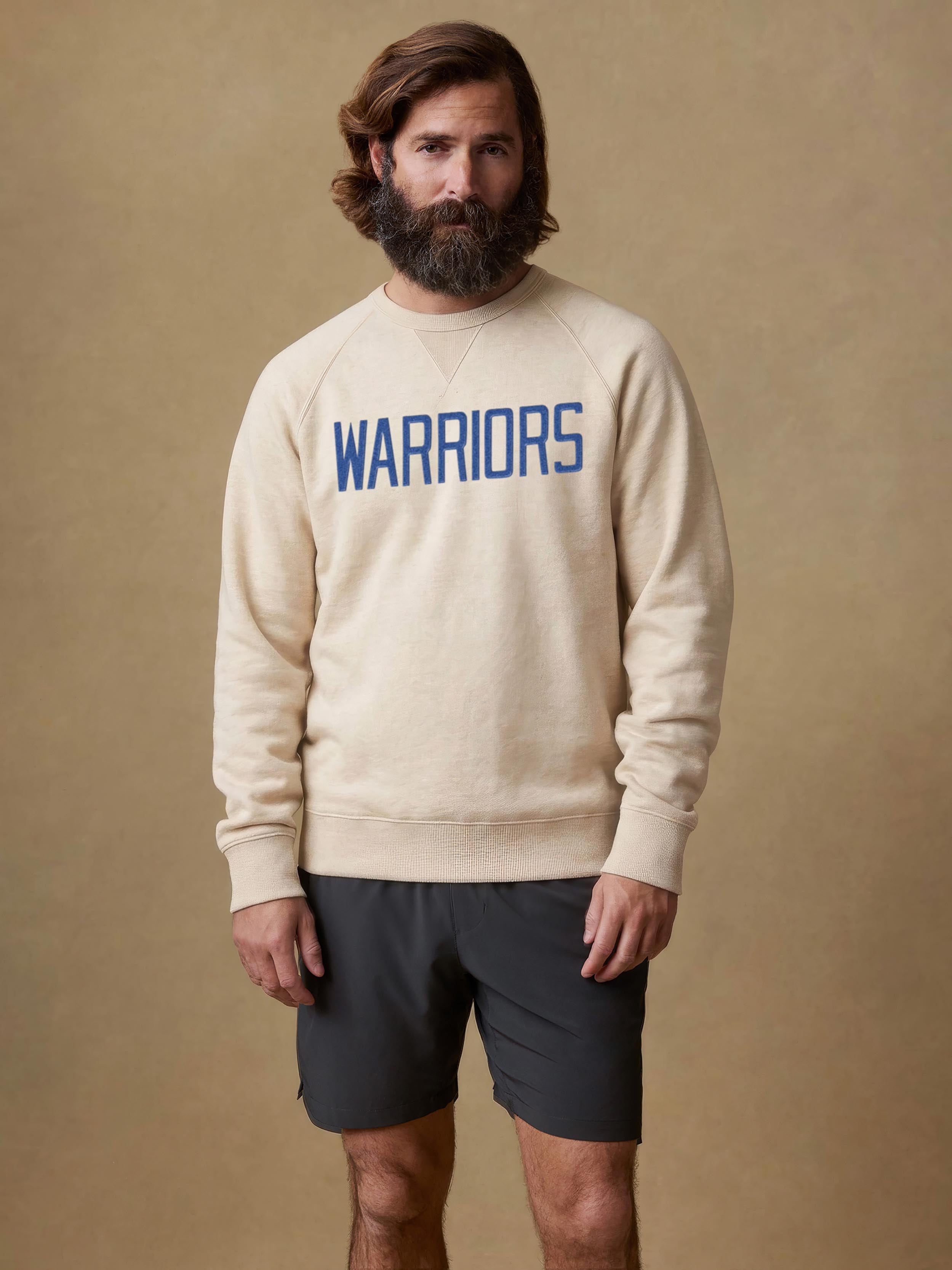 A man wearing a white Golden State Warriors crew