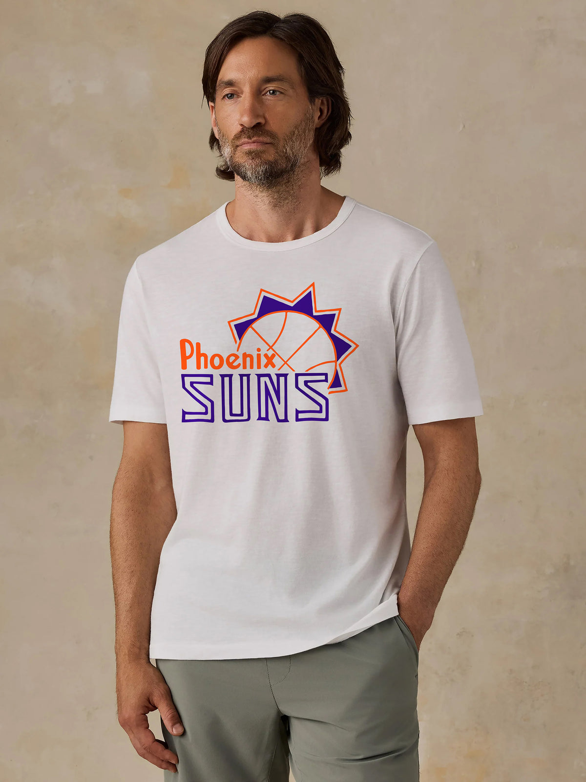 A man wearing a white Phoenix Suns tee, image 1 of 2
