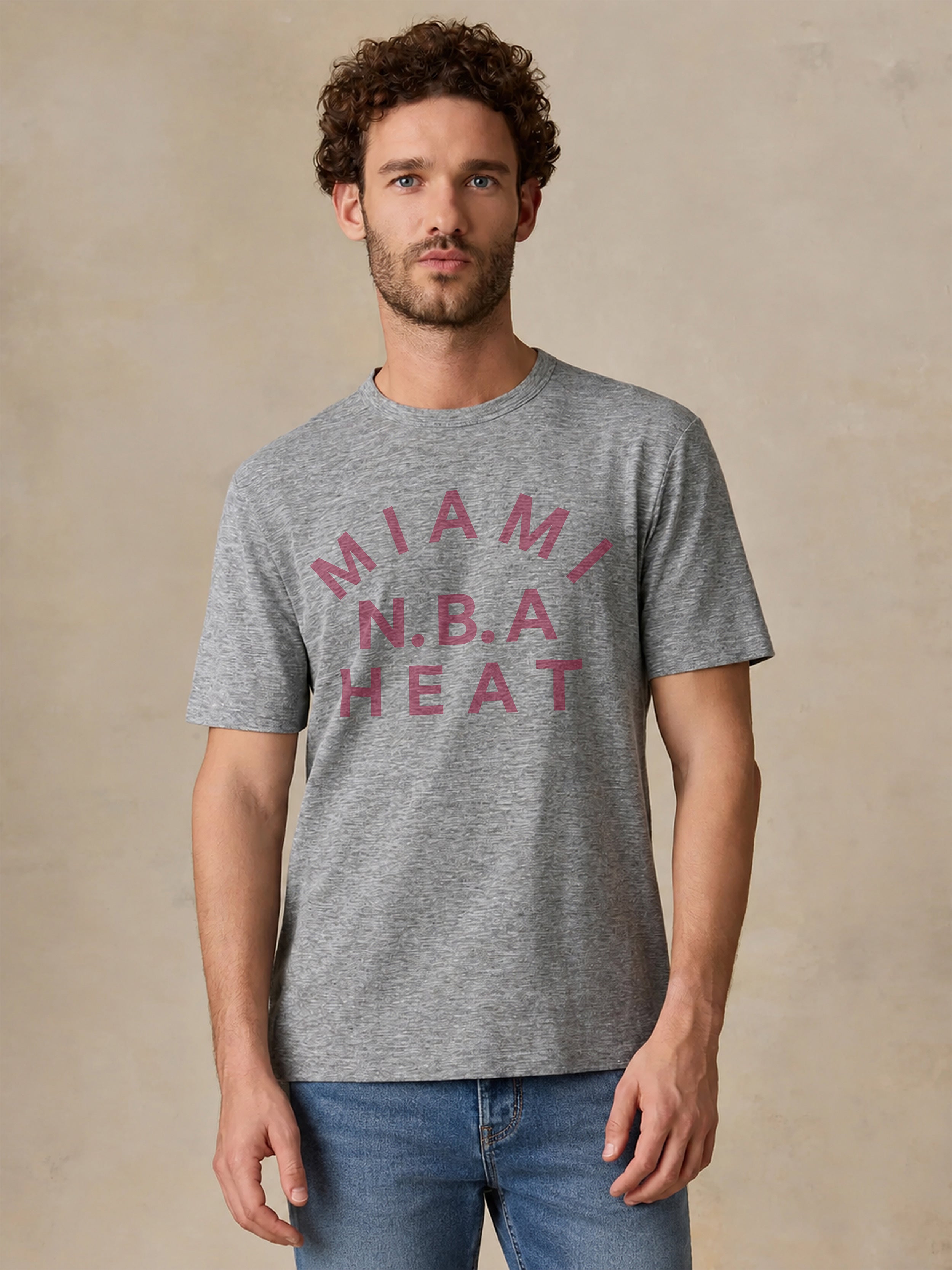 A man wearing a grey Miami Heat tee