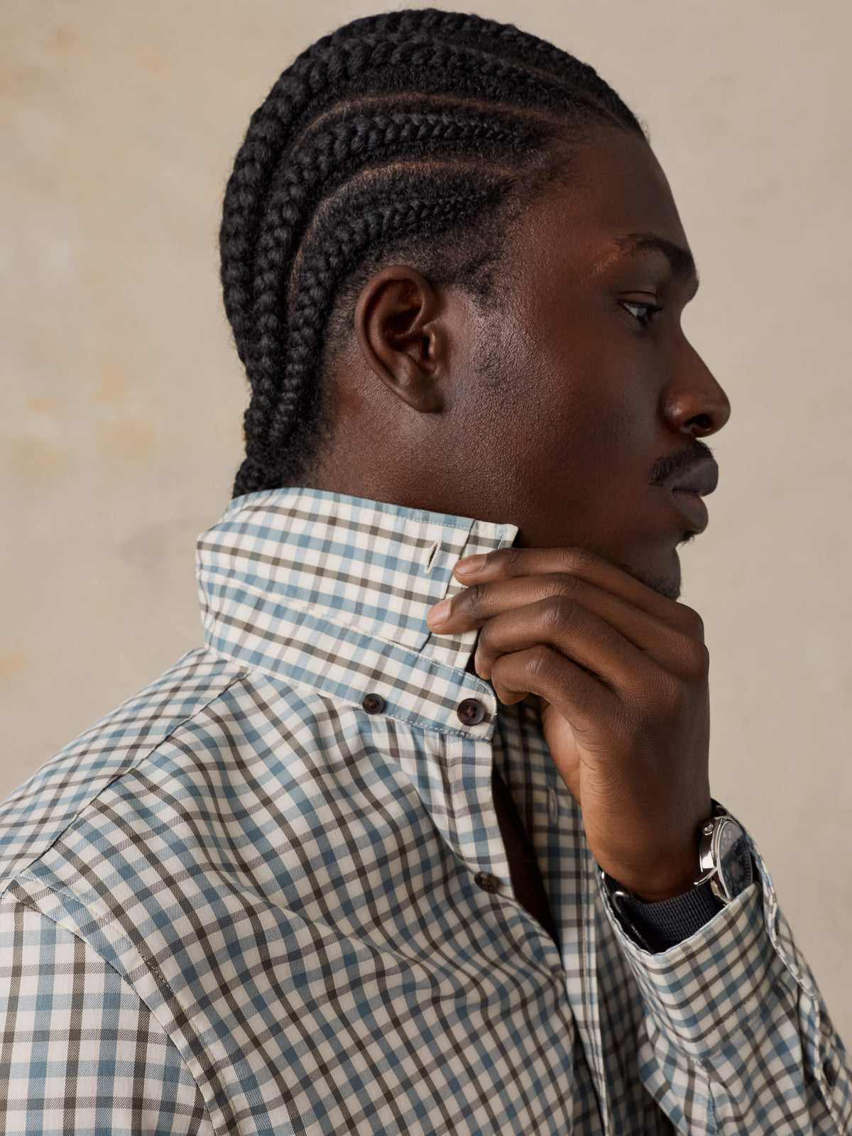 A man wearing a plaid shirt, image 4 of 5