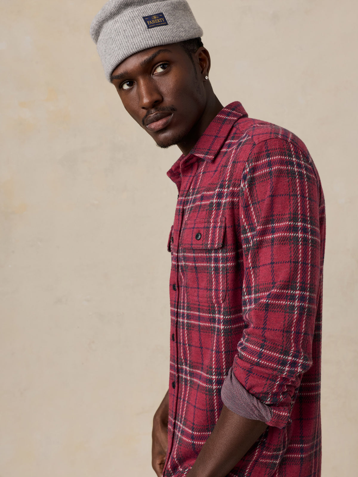Close up of a man wearing a red button up shirt , image 4 of 6