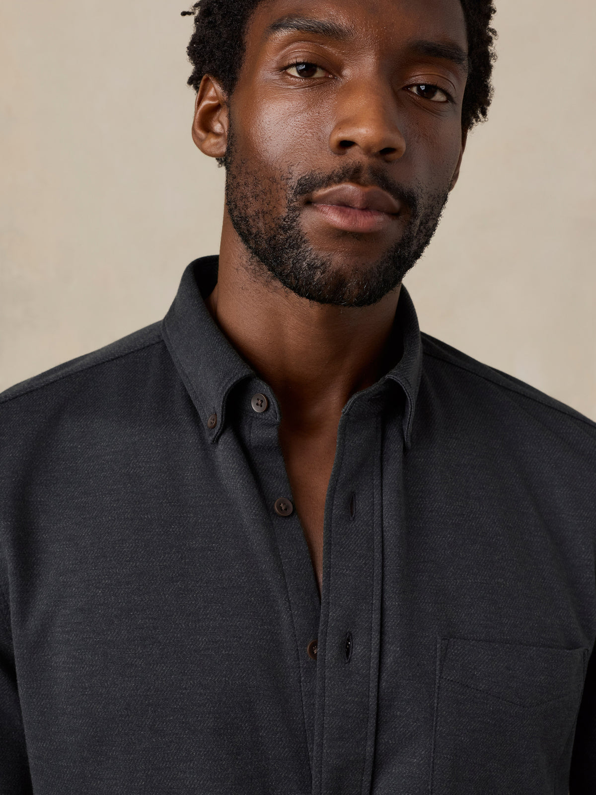 Close up of a  man wearing a black shirt , image 5 of 6