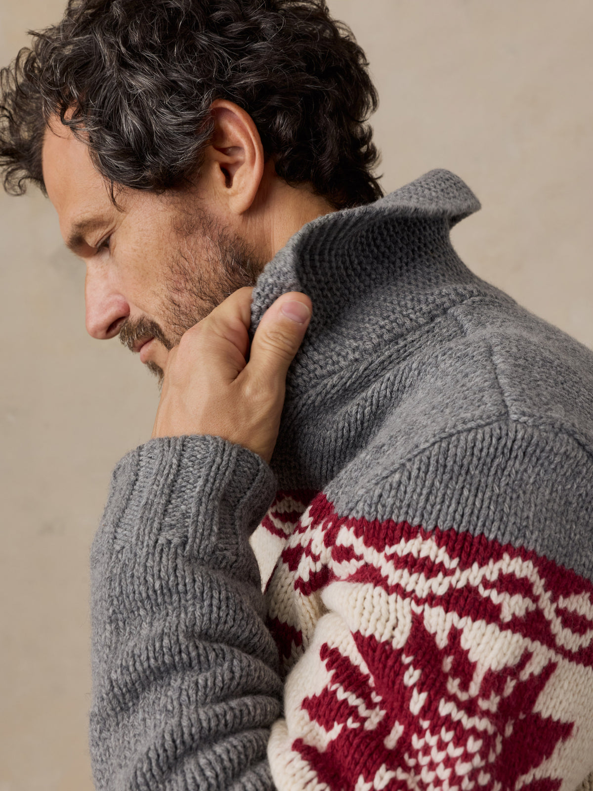 Close up of a man wearing a printed wool cardigan, image 5 of 5