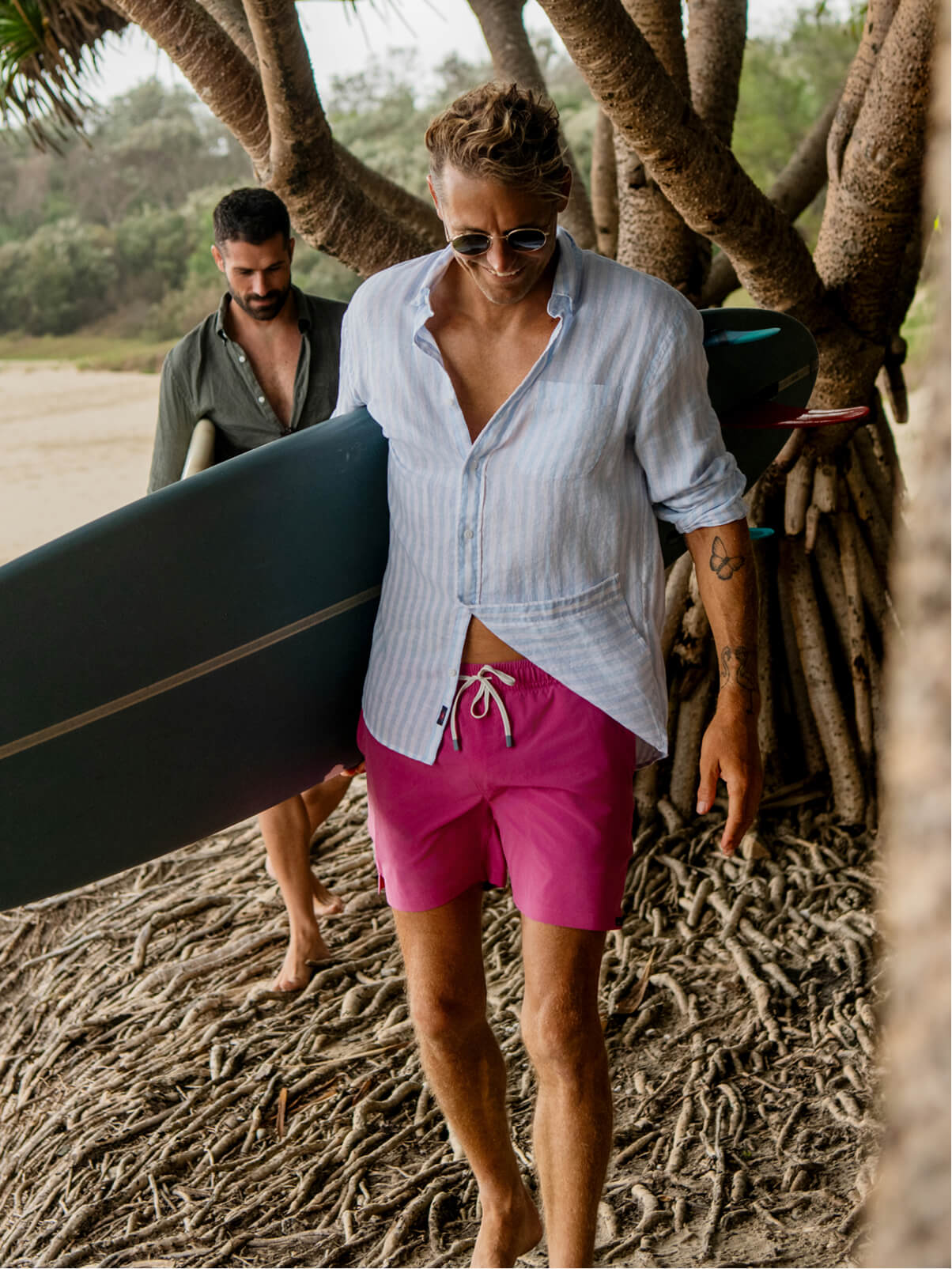 Man wearing laguna linen shirt and shorelite trunks