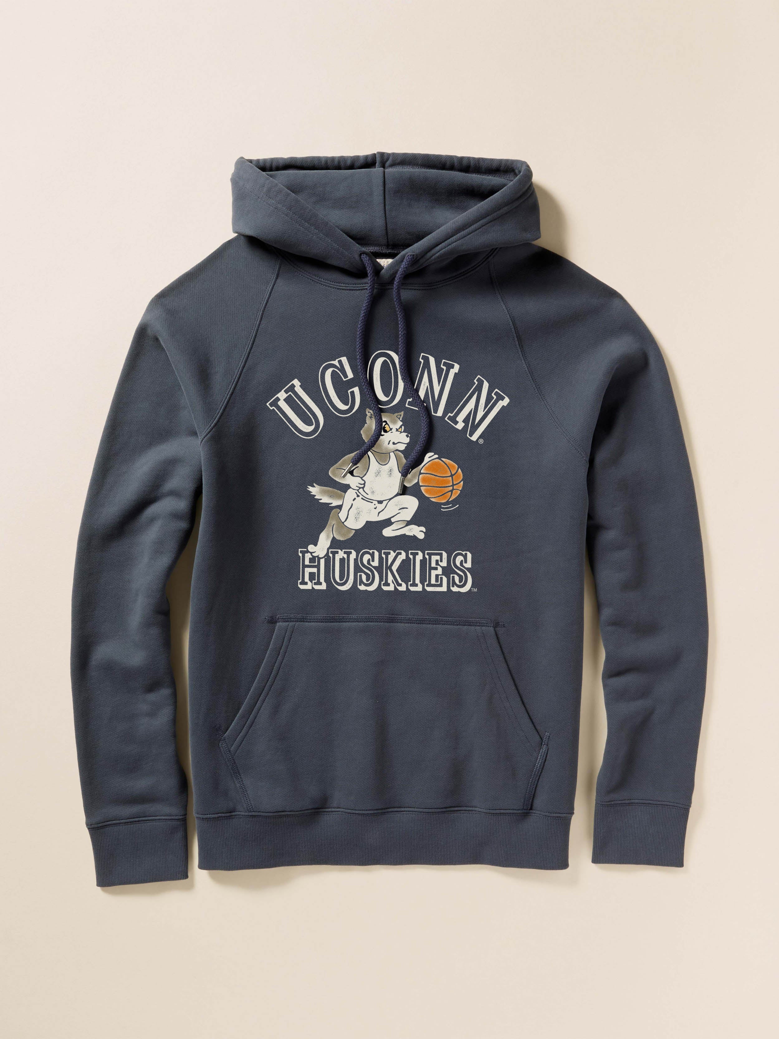 Navy blue hoodie with UConn Huskies graphic on the center front against a beige background