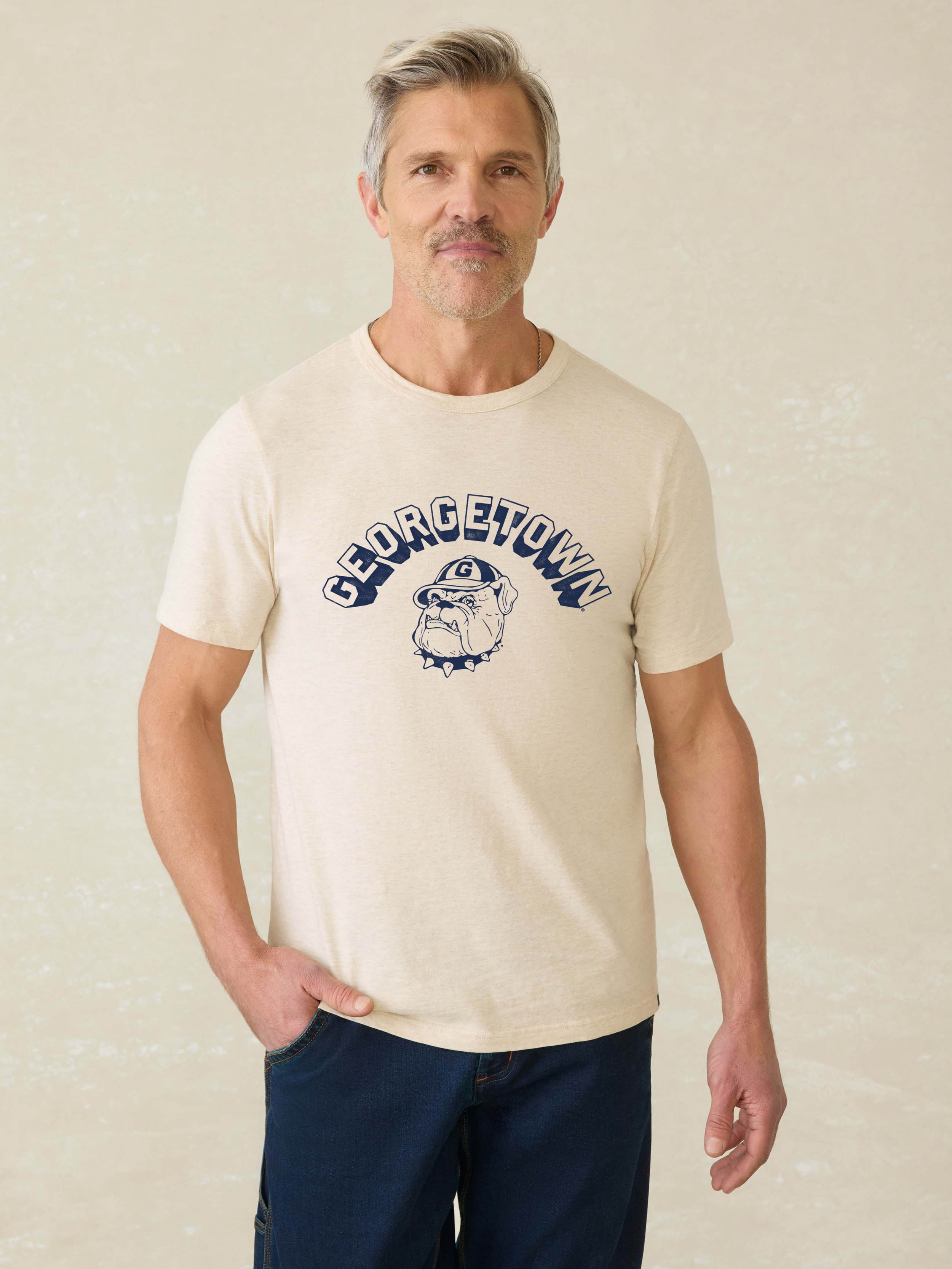 Heather grey short sleeve t-shirt with Georgetown graphic at the front against a beige background