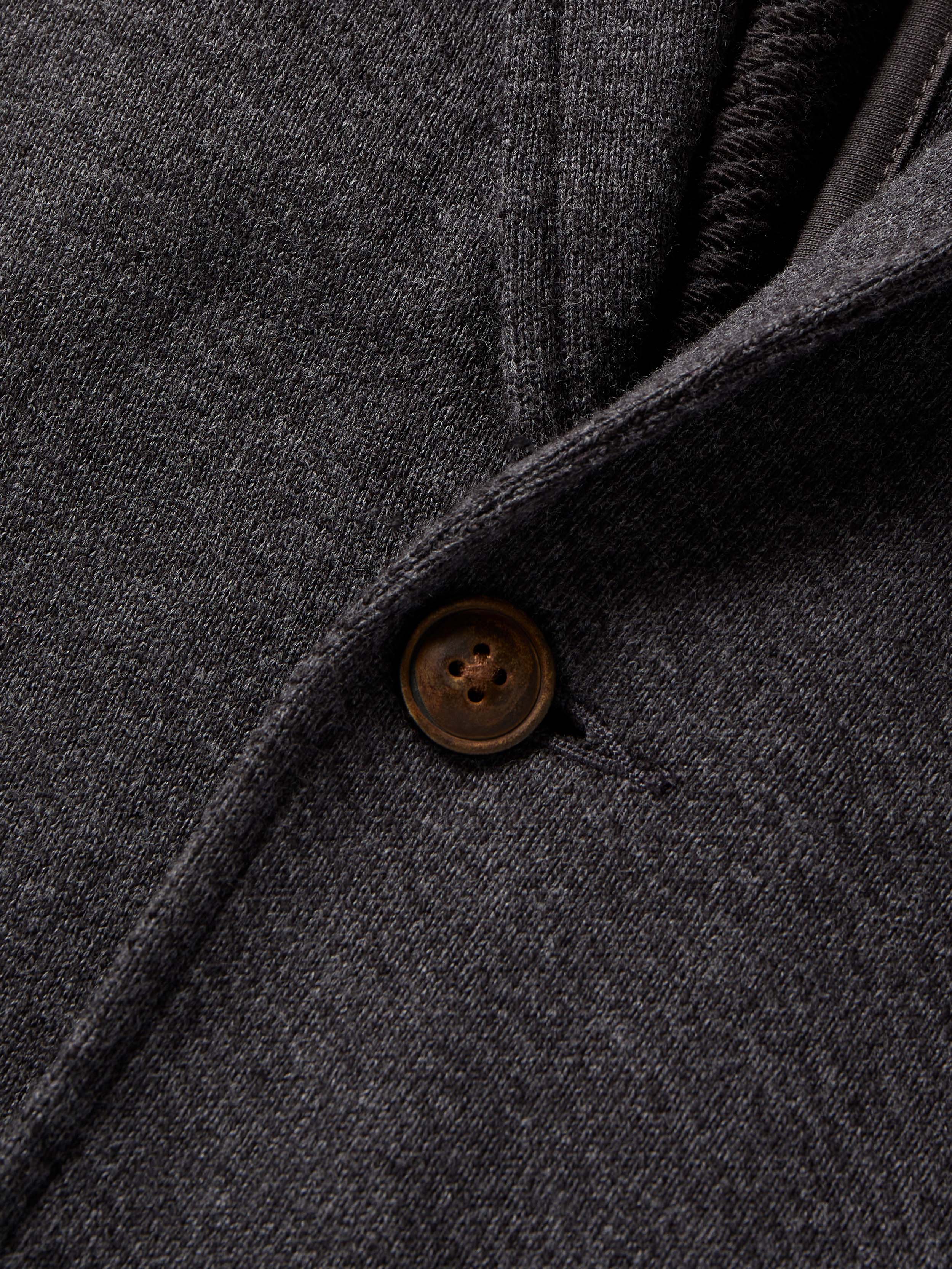 Close-up of a dark gray fabric with a button