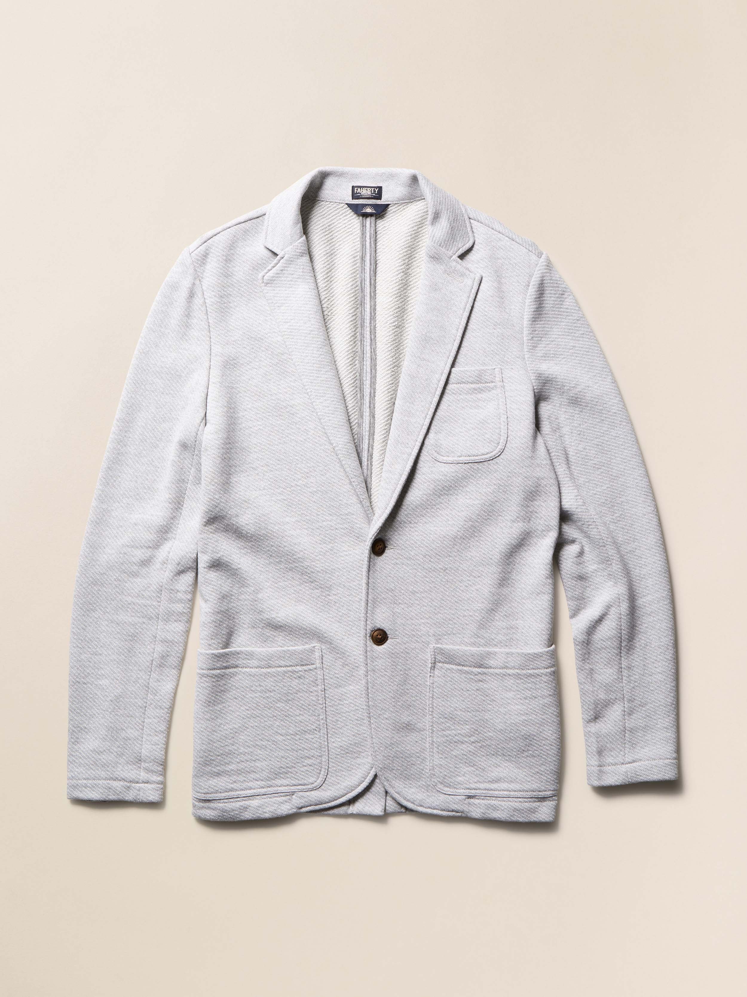 Light gray blazer on a beige background