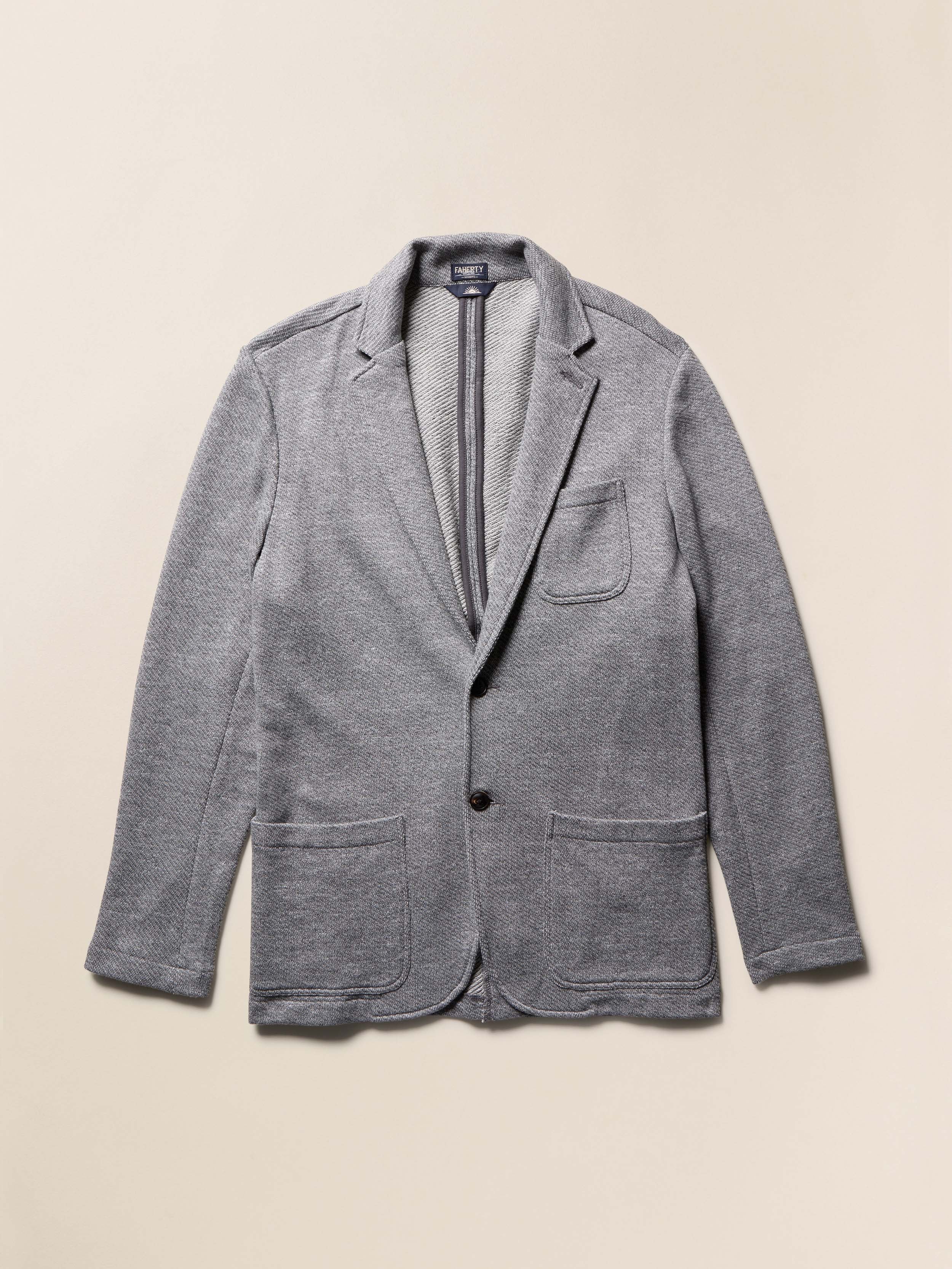Gray blazer on a beige background