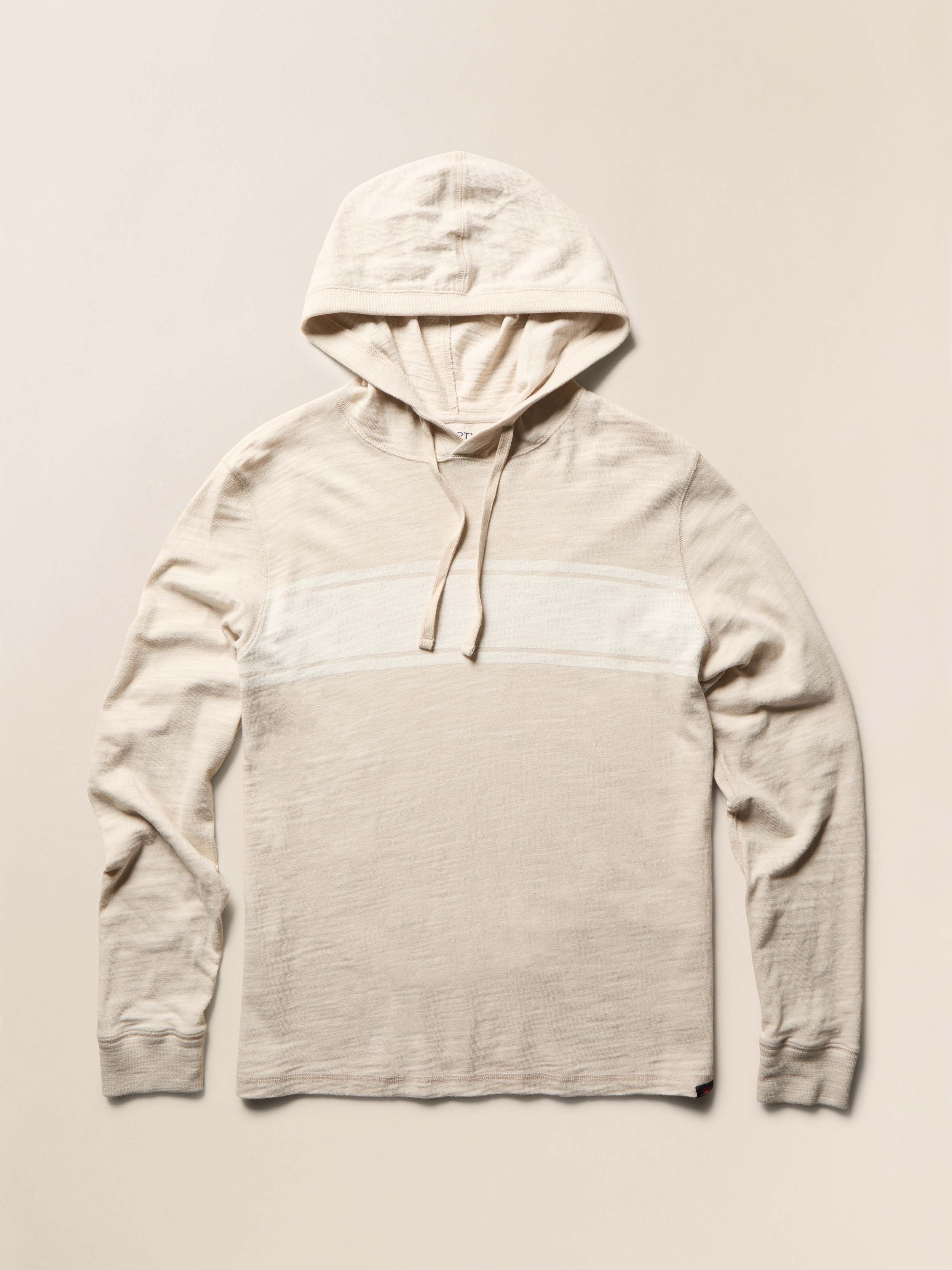 Beige hoodie with a white stripe on the center front against a beige background