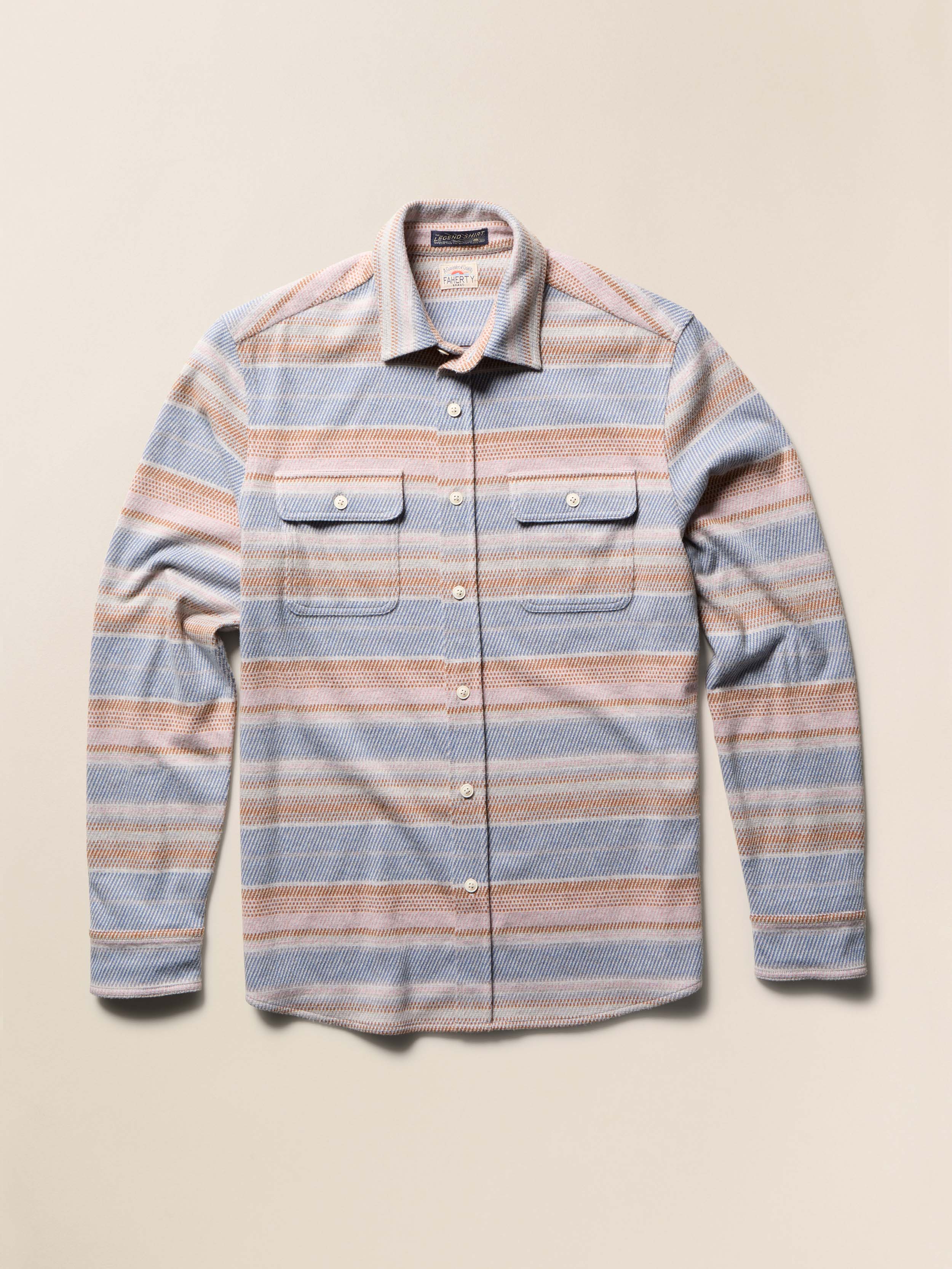 Striped shirt with a collar and two chest pockets on a beige background