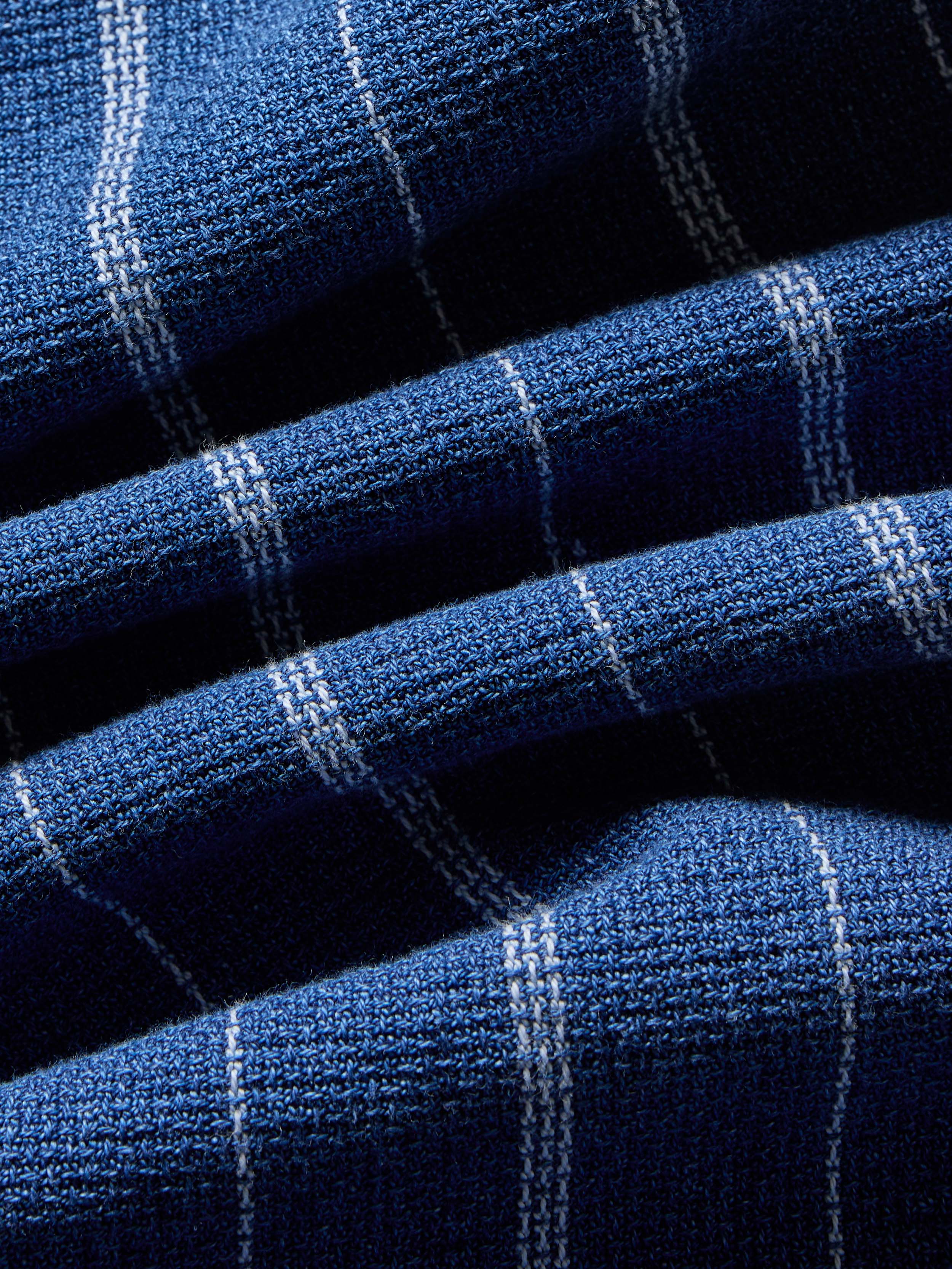 Close-up of blue striped fabric with white lines