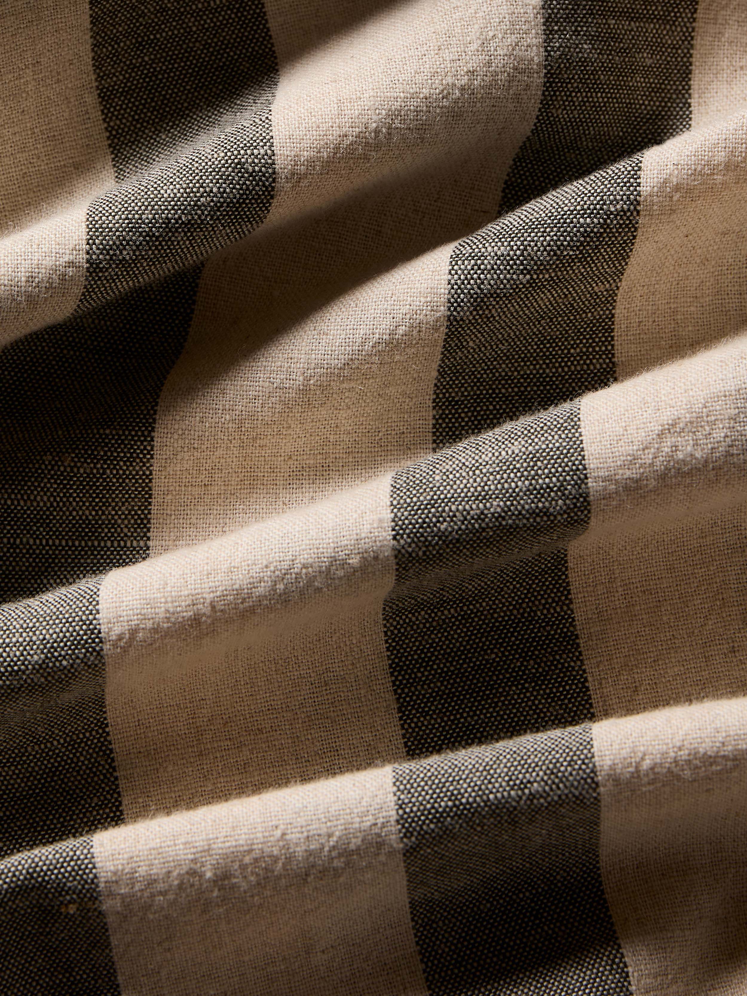 Close-up of green and beige striped fabric