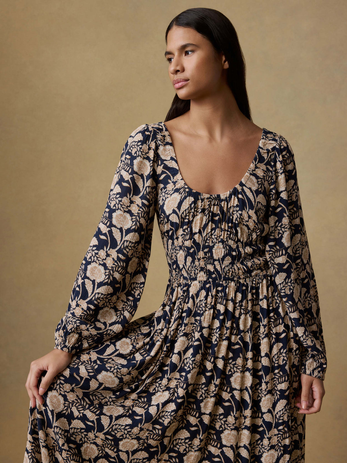 Close up of a woman wearing a floral printed dress, image 3 of 5