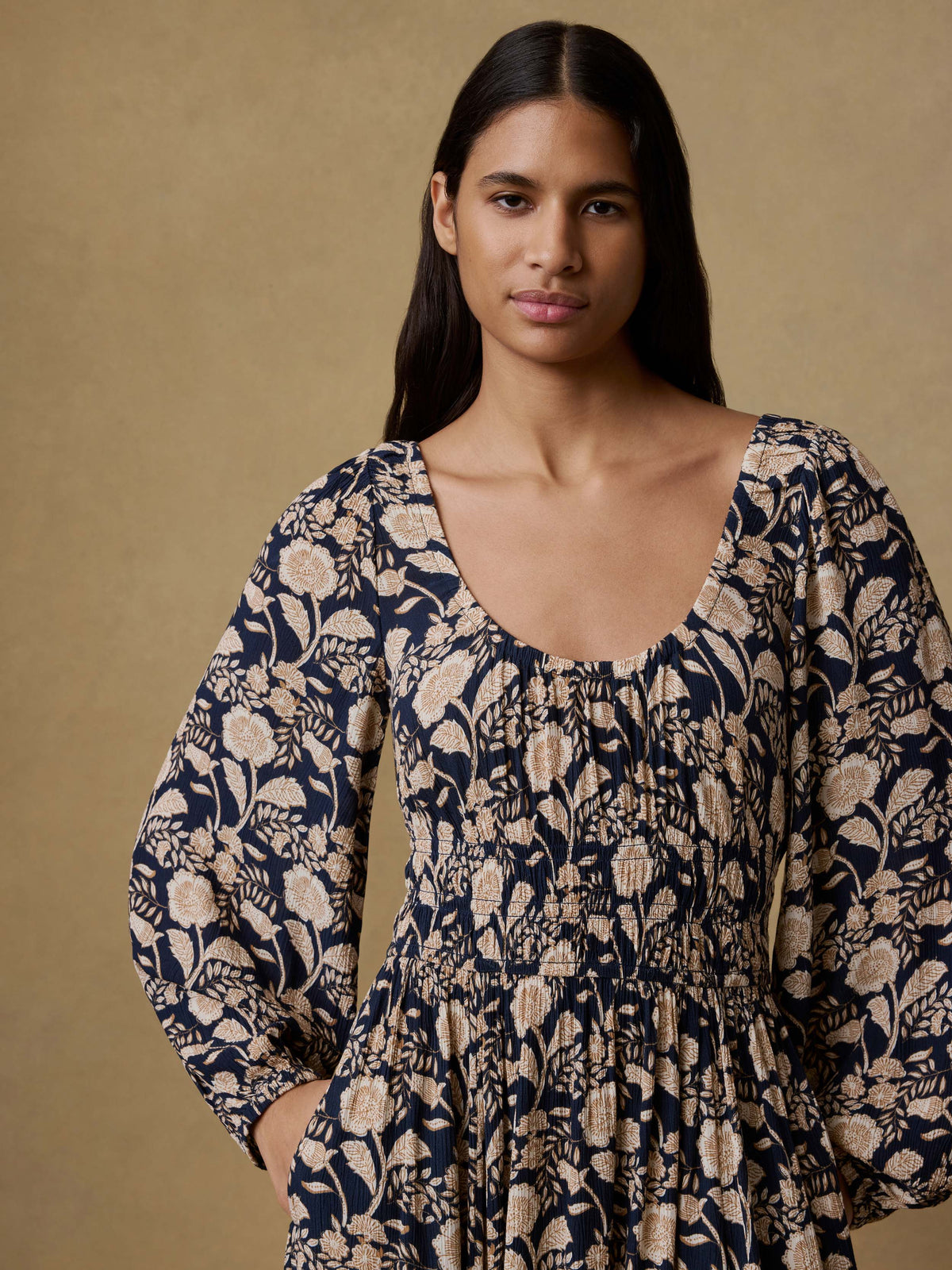 Close up of a woman wearing a floral printed dress, image 2 of 5