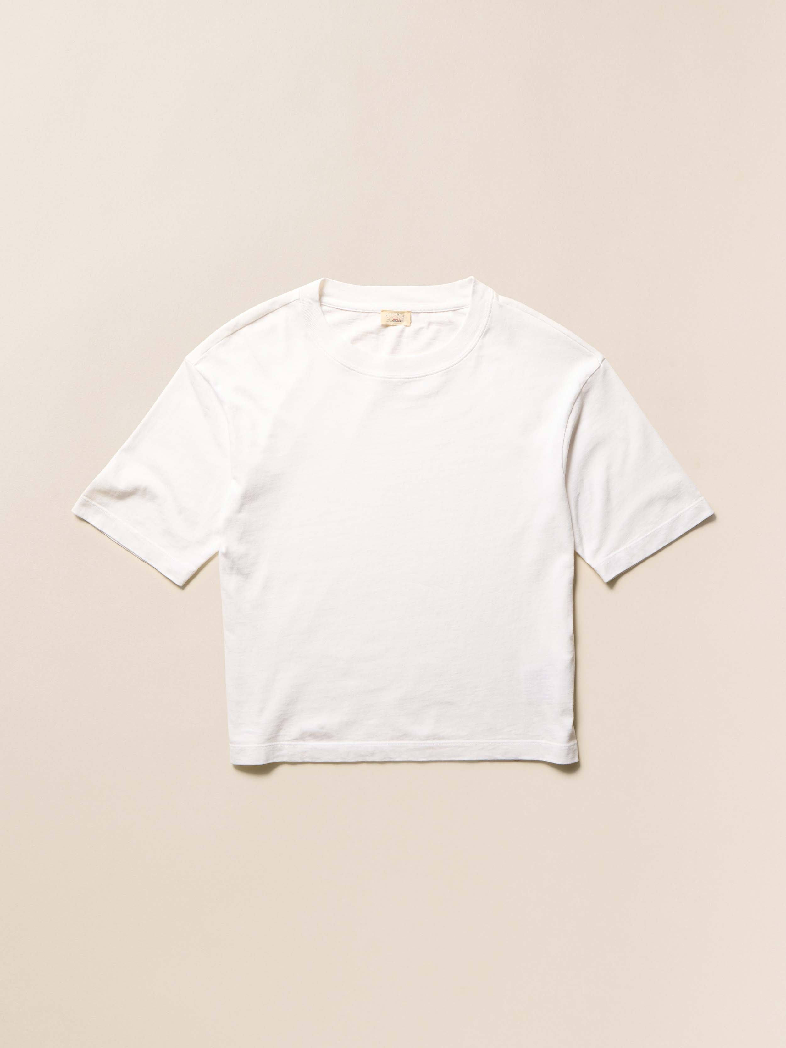 White cotton t-shirt on a beige background