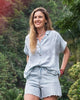 Our founder Kerry in Hawaii wearing the Tried & True Breeze Shirt and Organic Cotton Denim Shorts.
